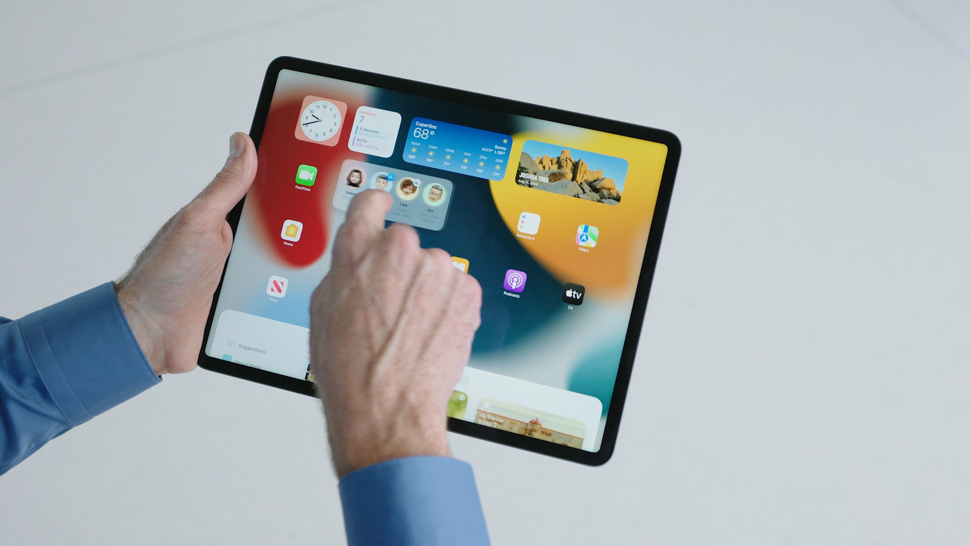 person navigating ipad home screen