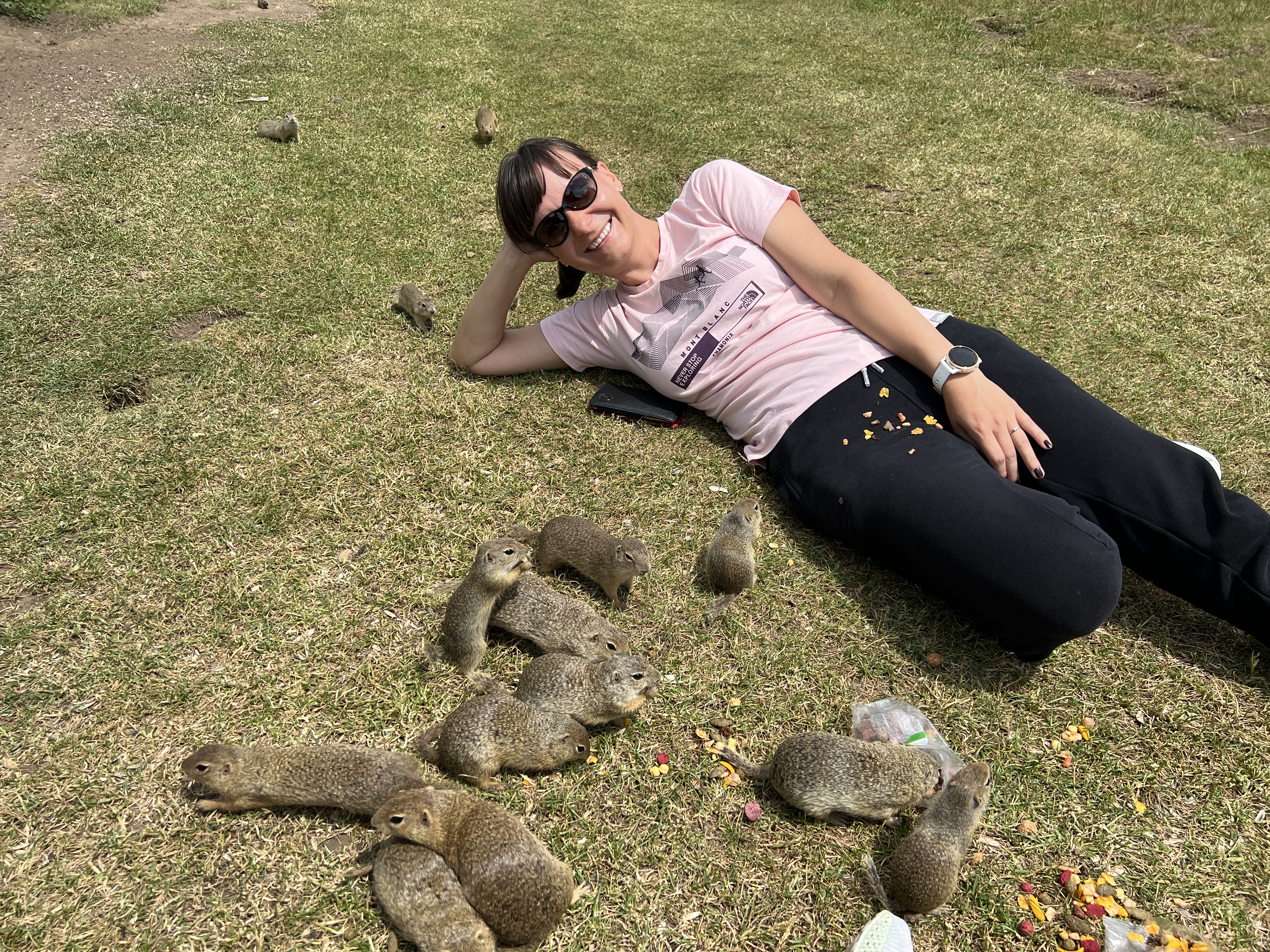 person relaxing with ground squirrels