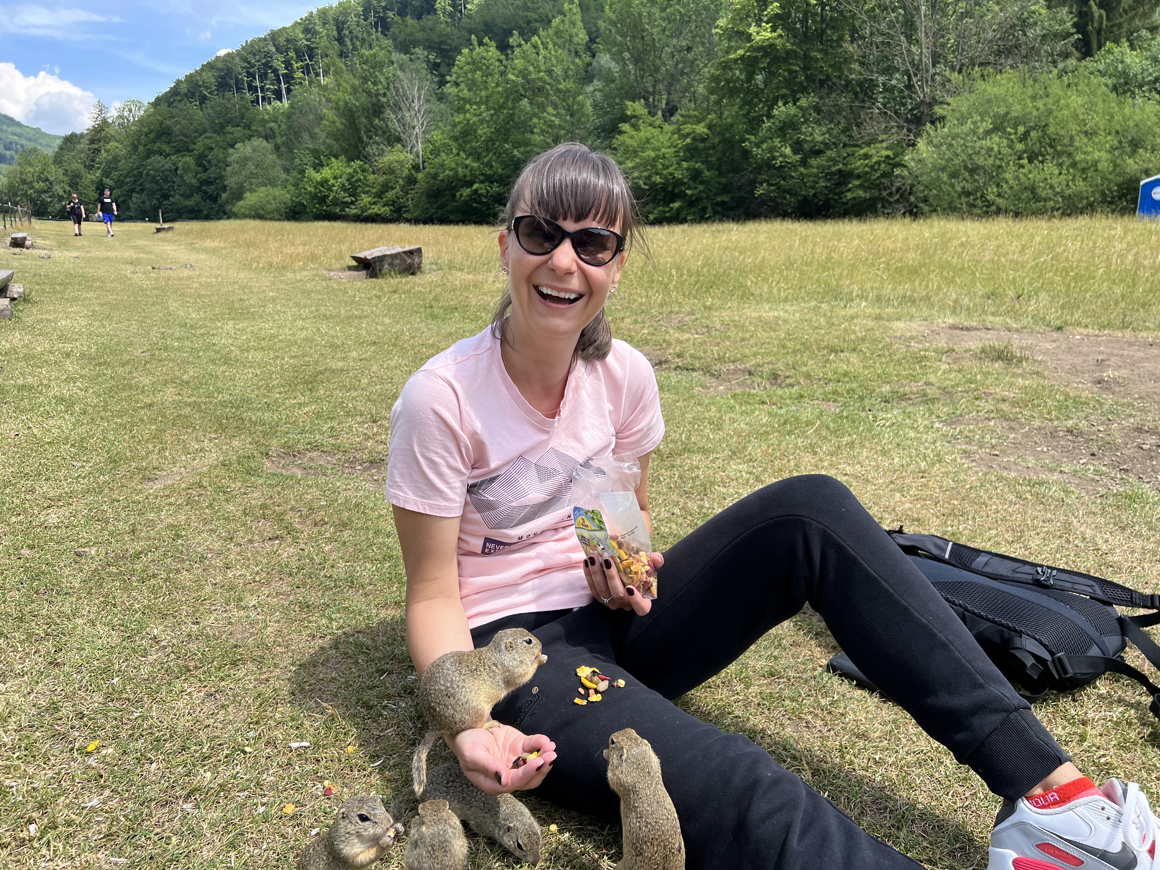 person smiling with ground squirrels