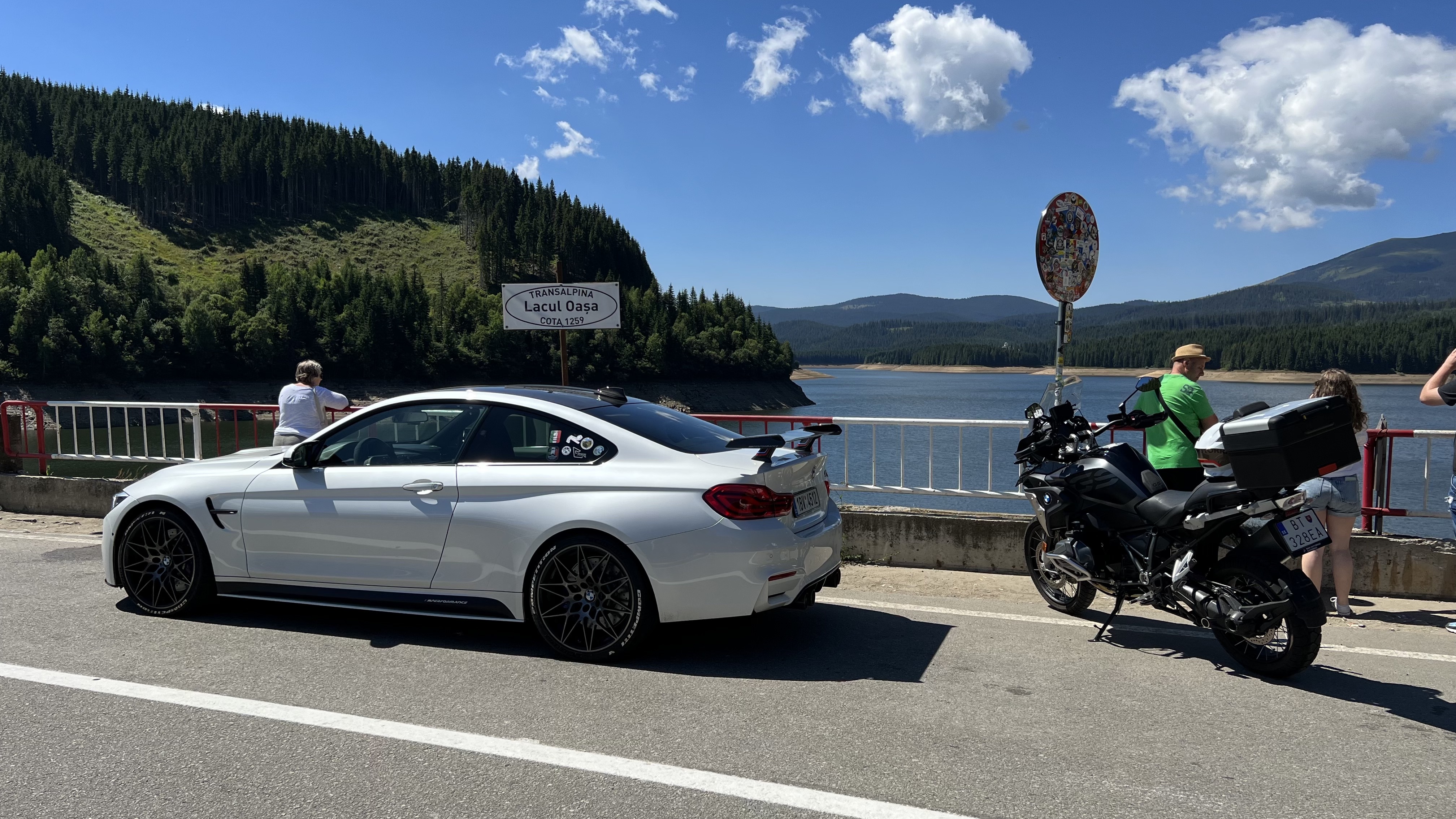 white bmw motorcycle lake