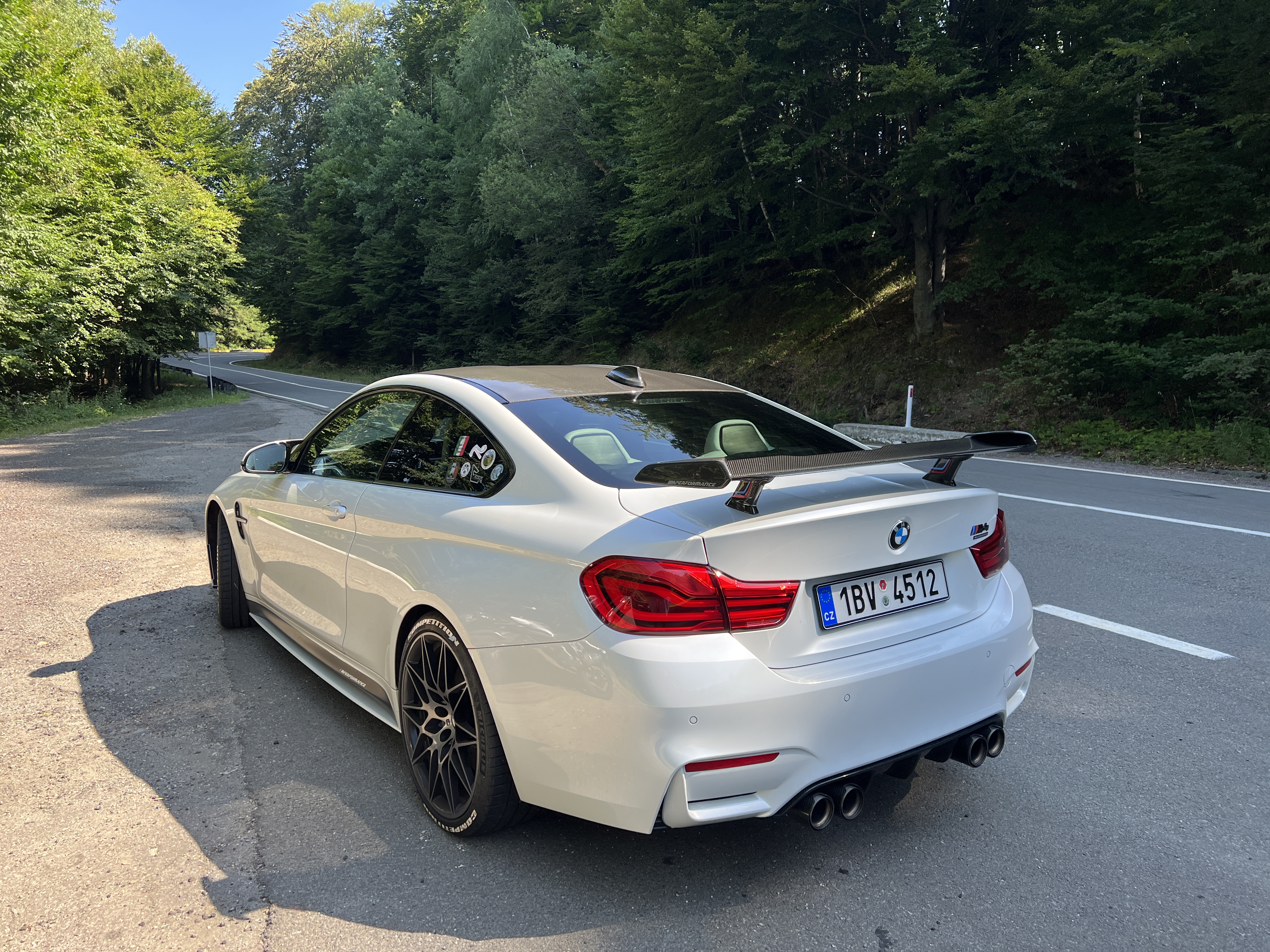 white bmw parked roadside
