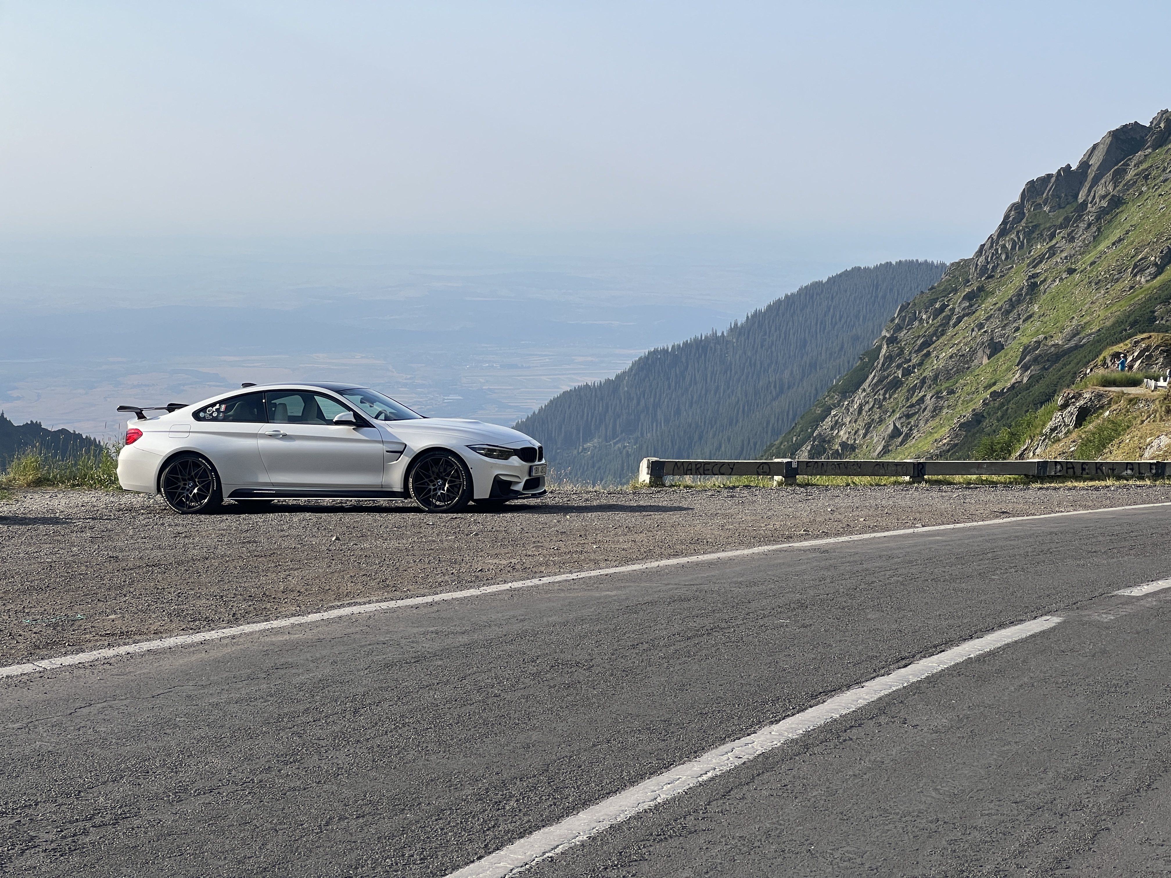 white car roadside view