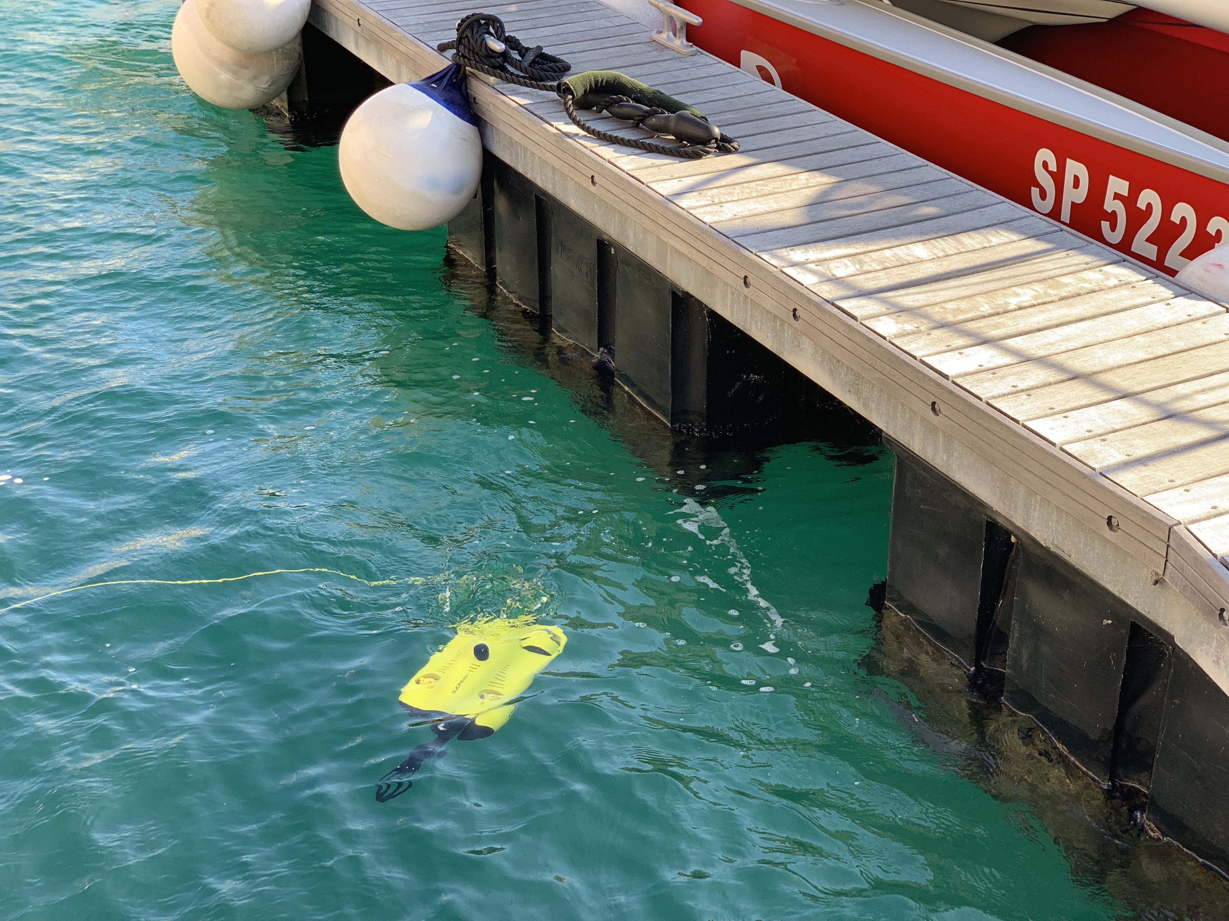 drone near dock in water