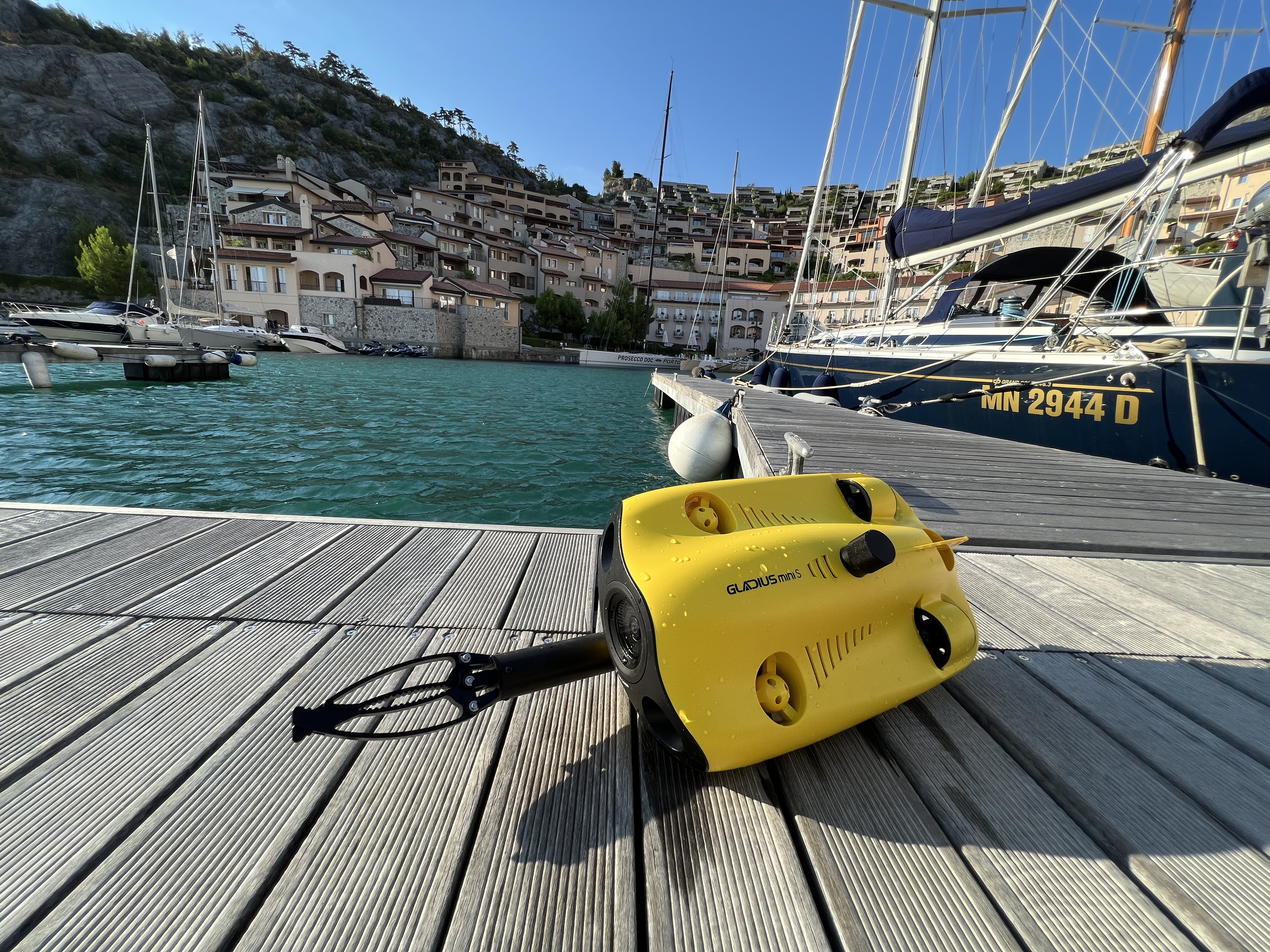 drone on dock with boats