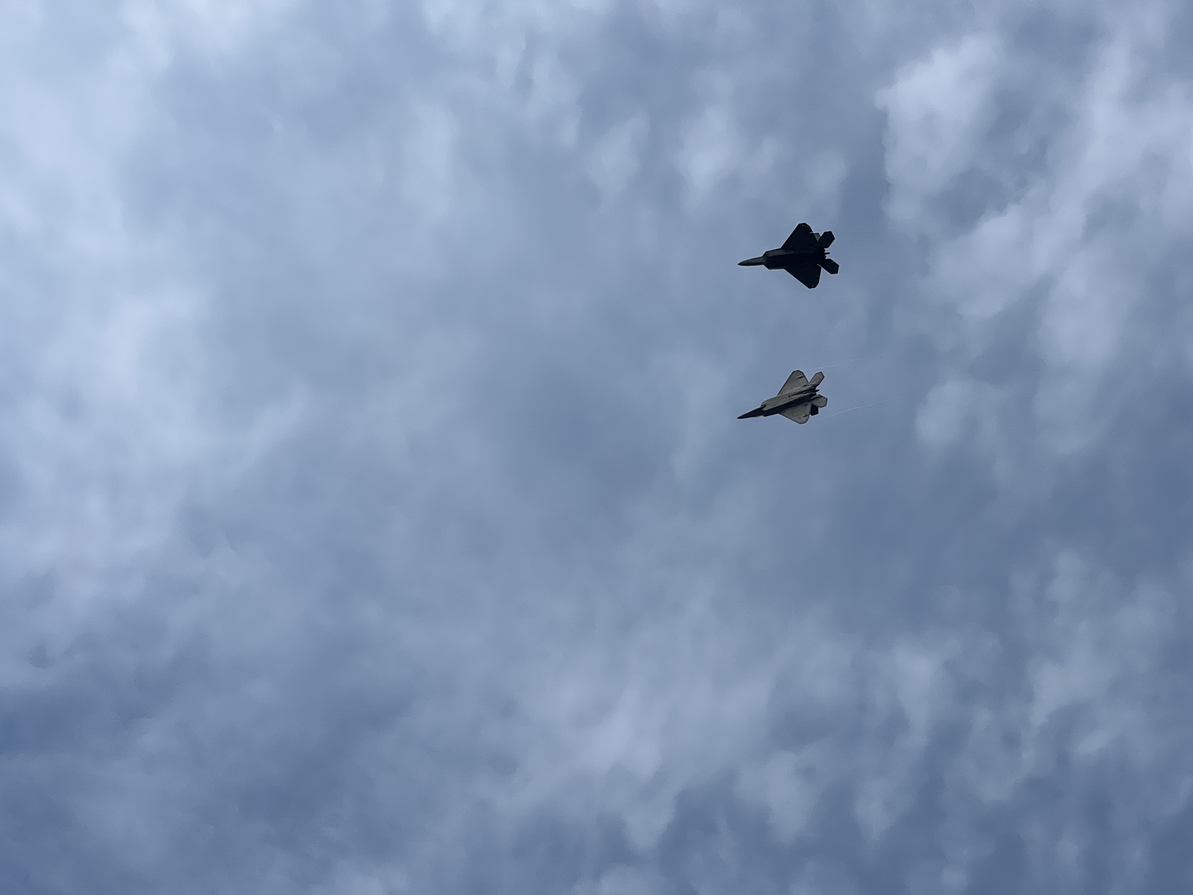 two jets in cloudy sky