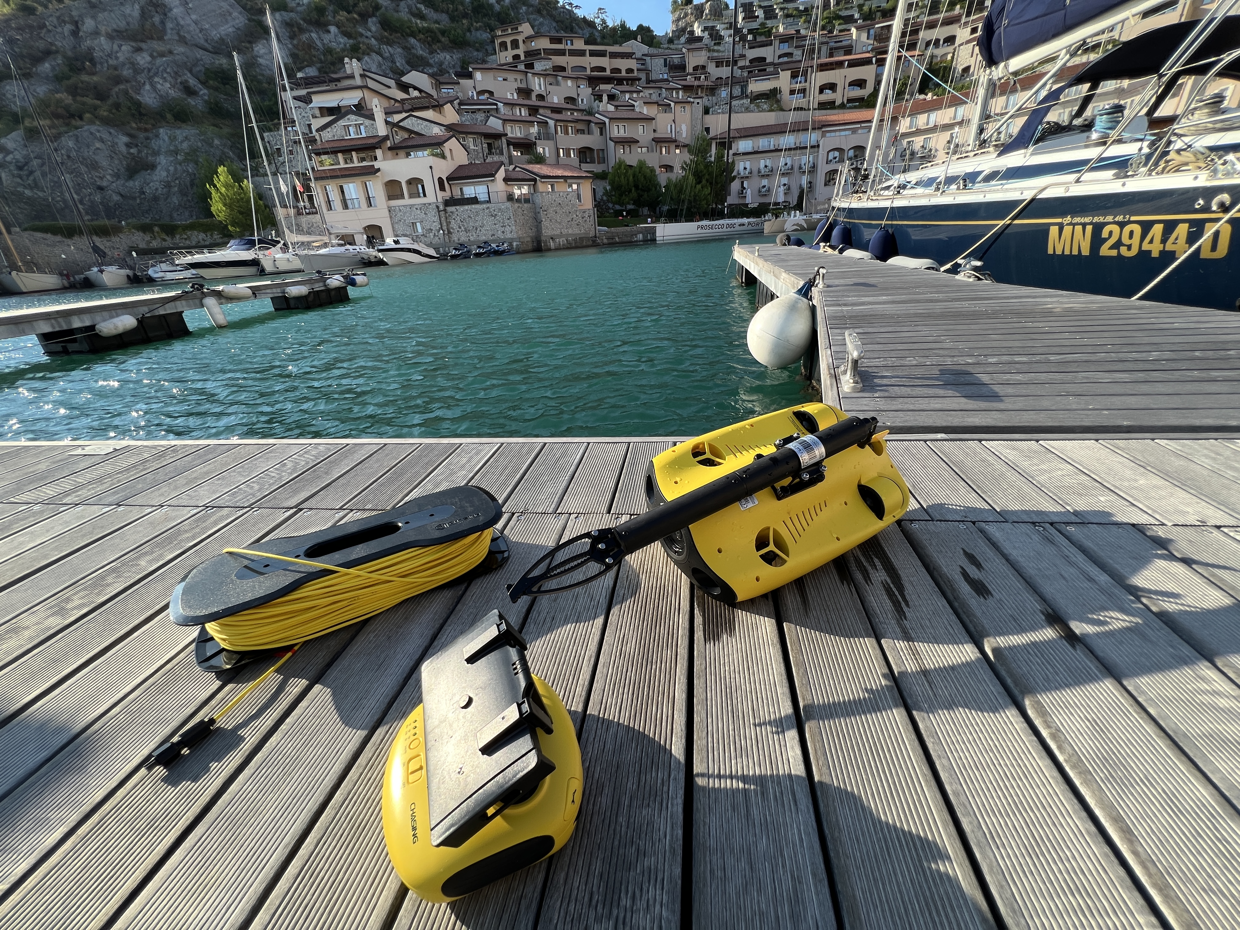 underwater drone and cable on dock