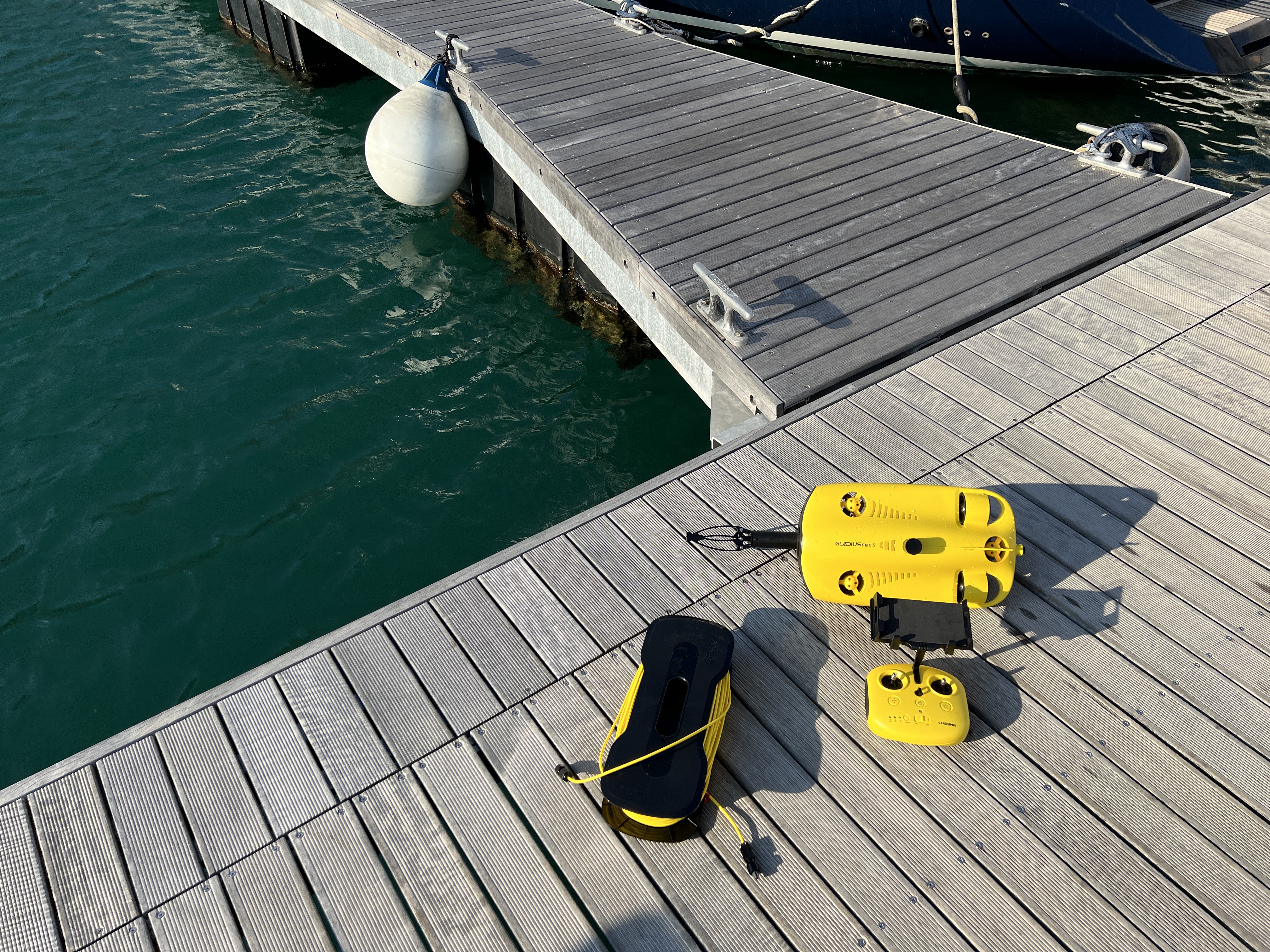 underwater drone and cable over water