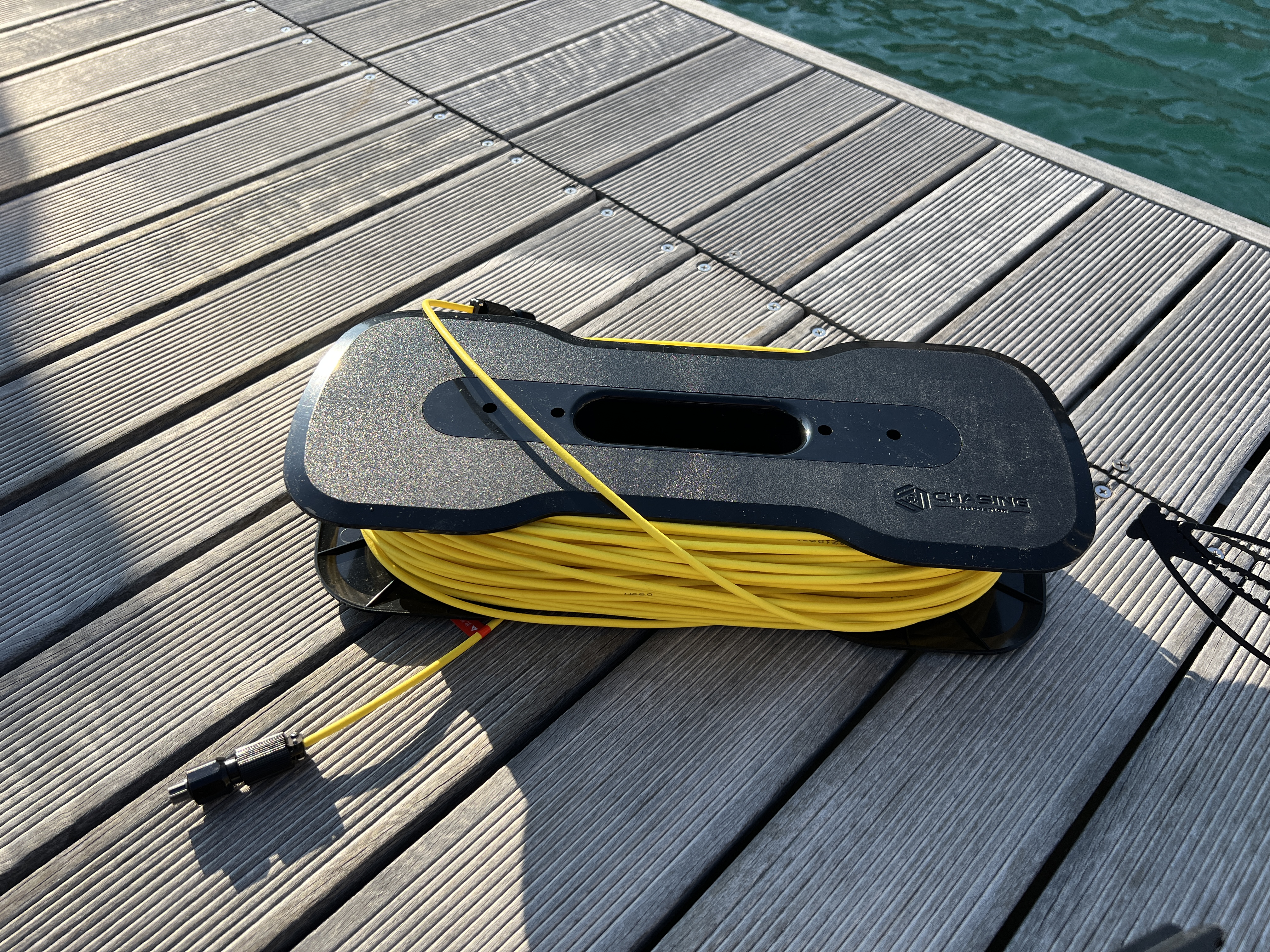 yellow cable reel on dock