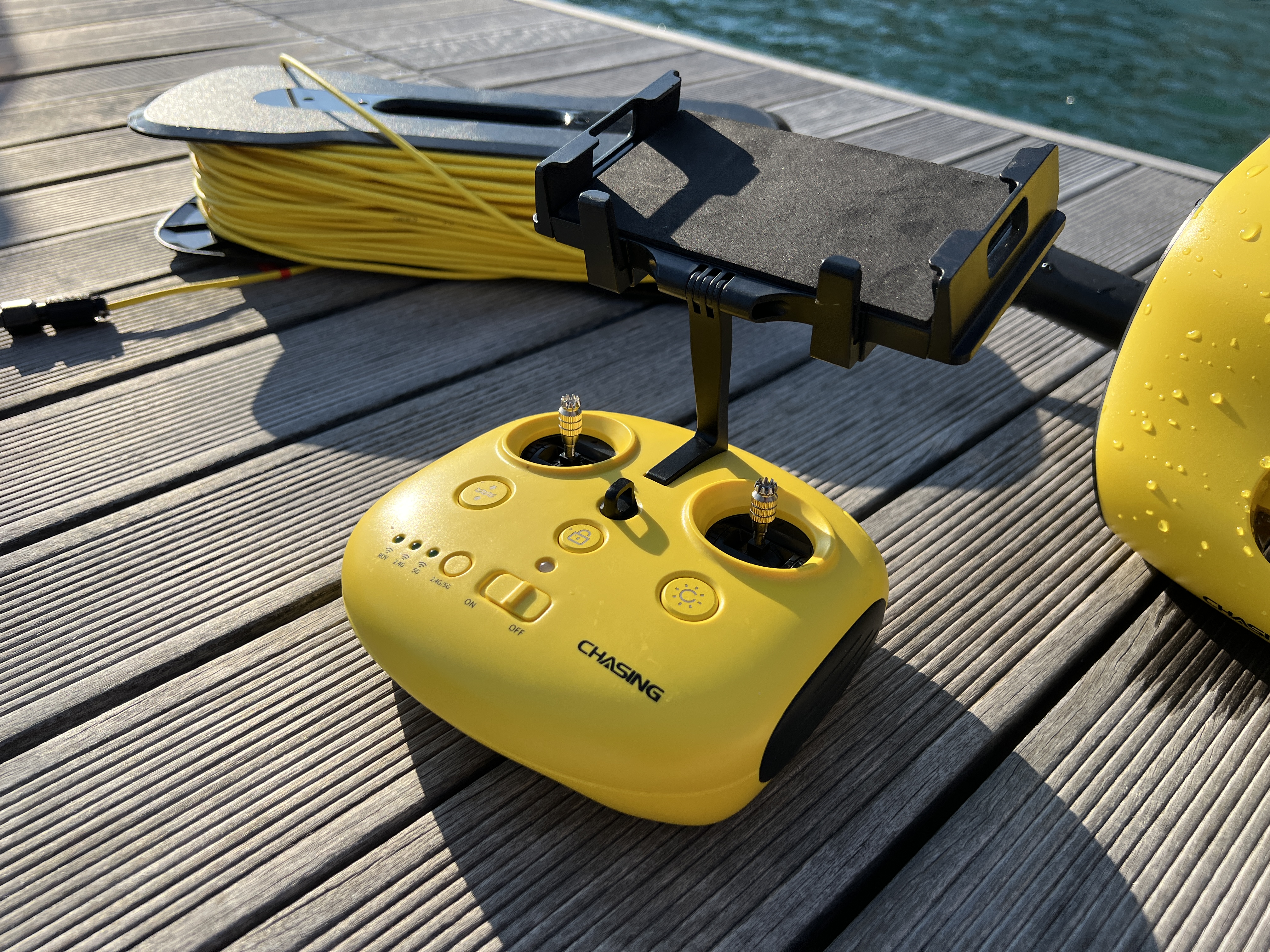 yellow drone controller on dock