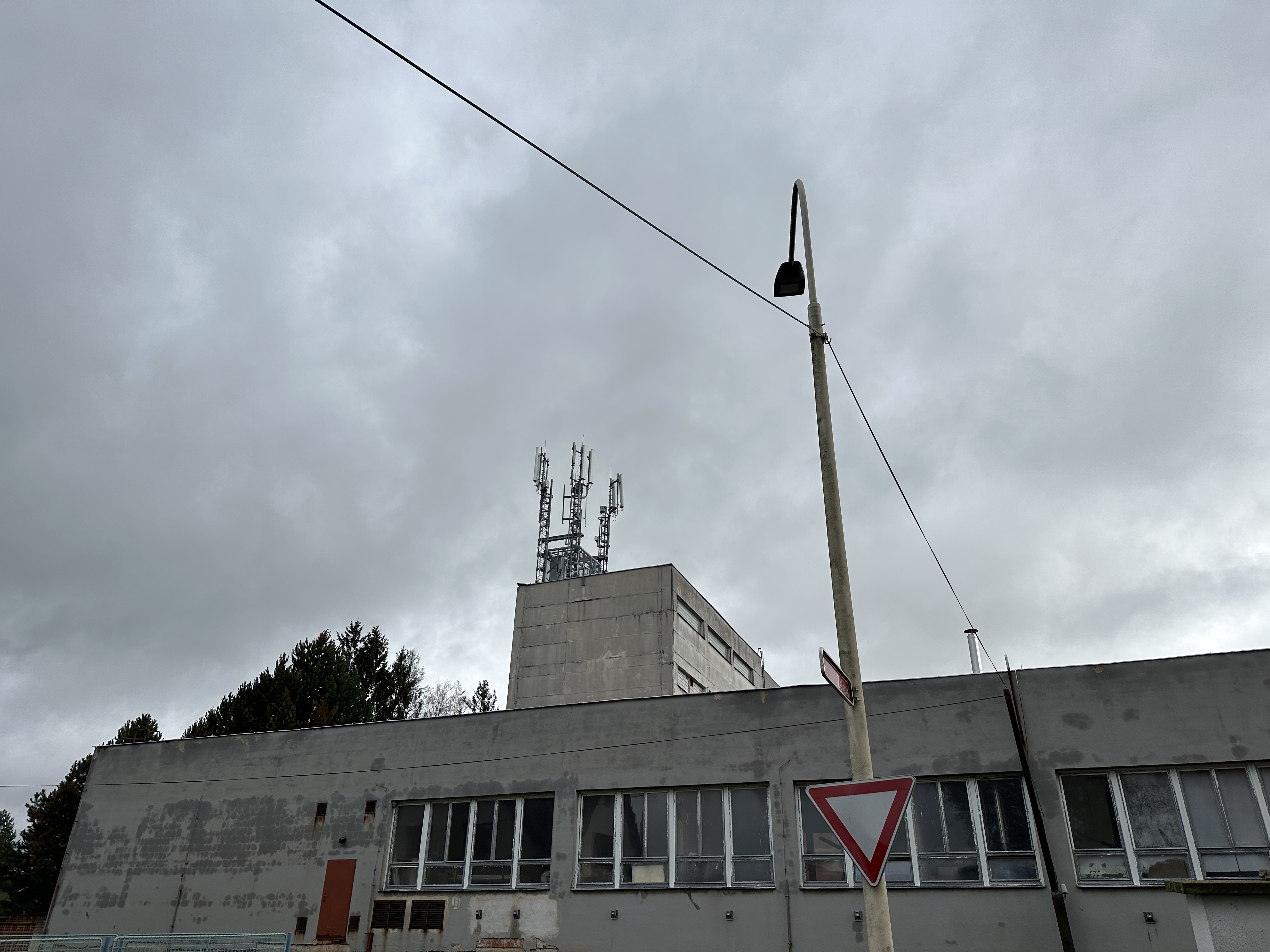 building antenna cloudy sky