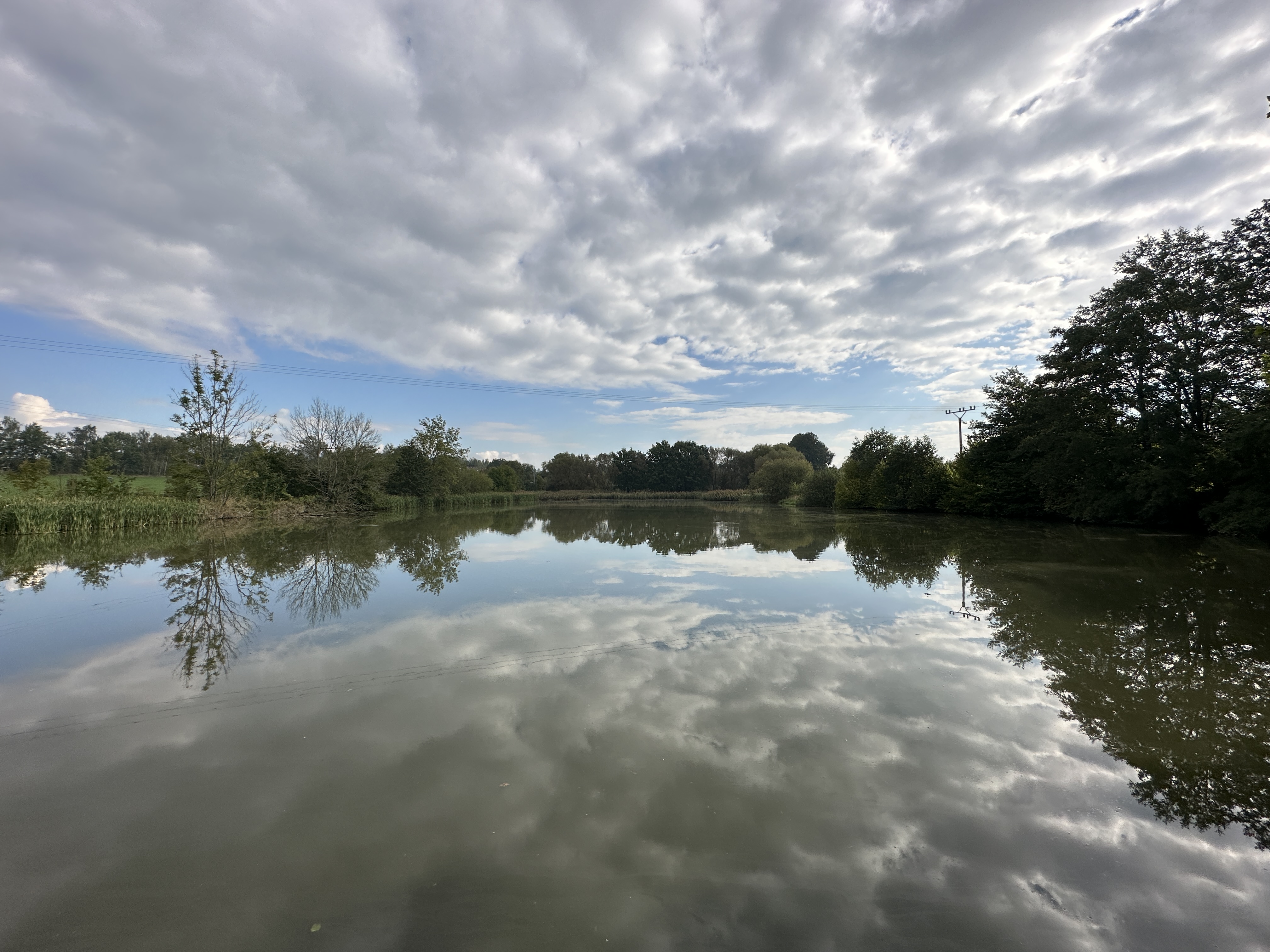 calm lake reflection clouds