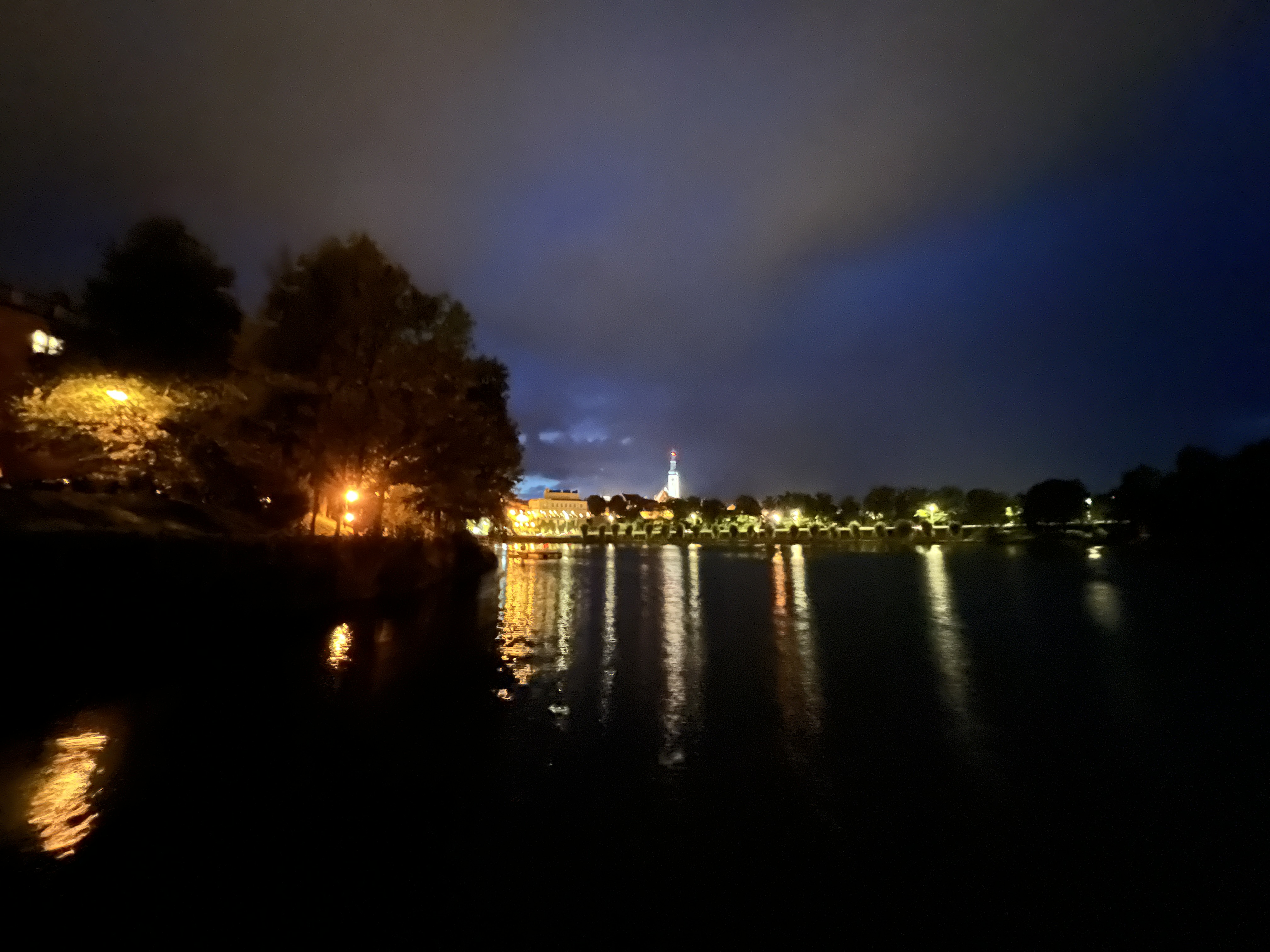 city lights reflecting on water