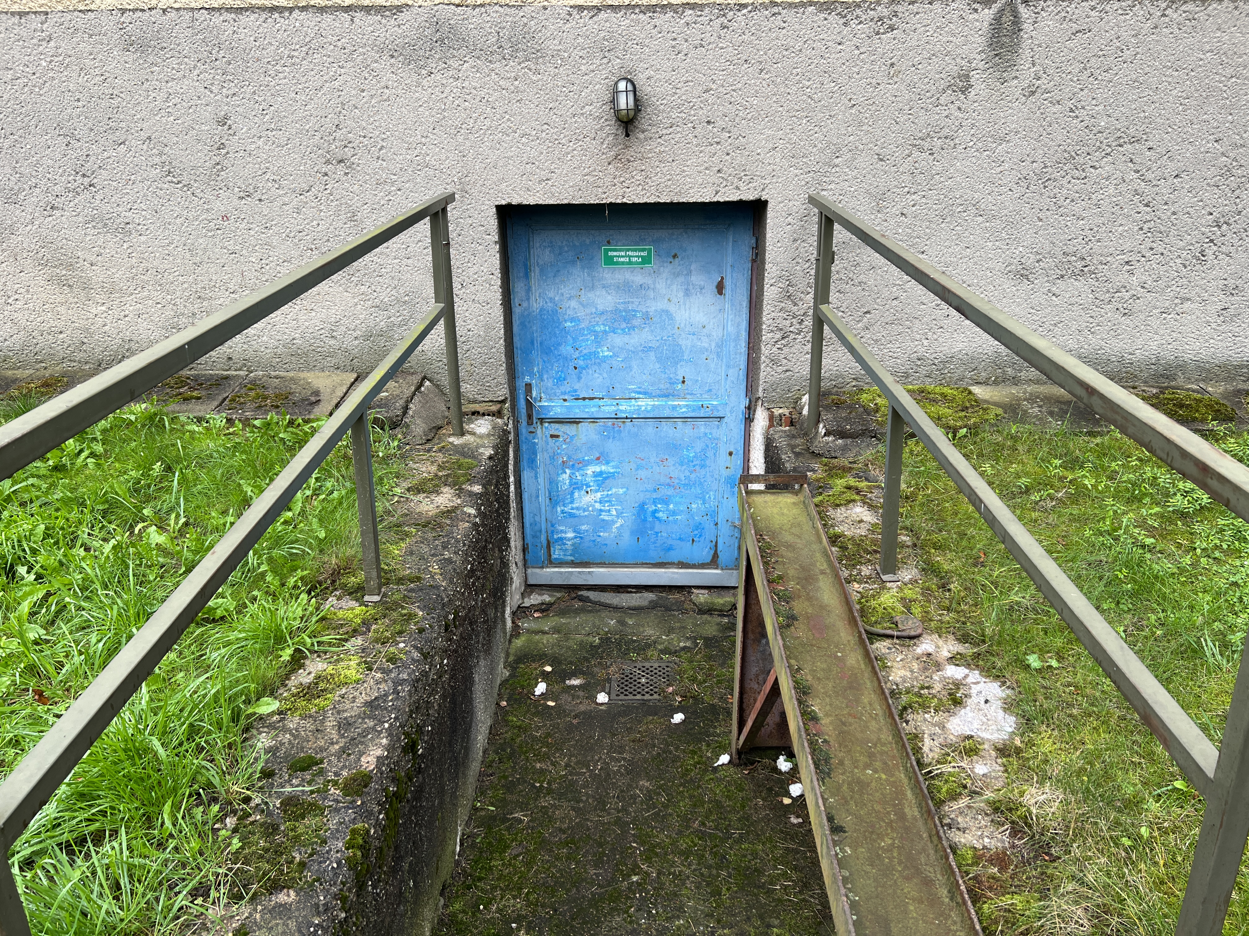 close up blue door with railings
