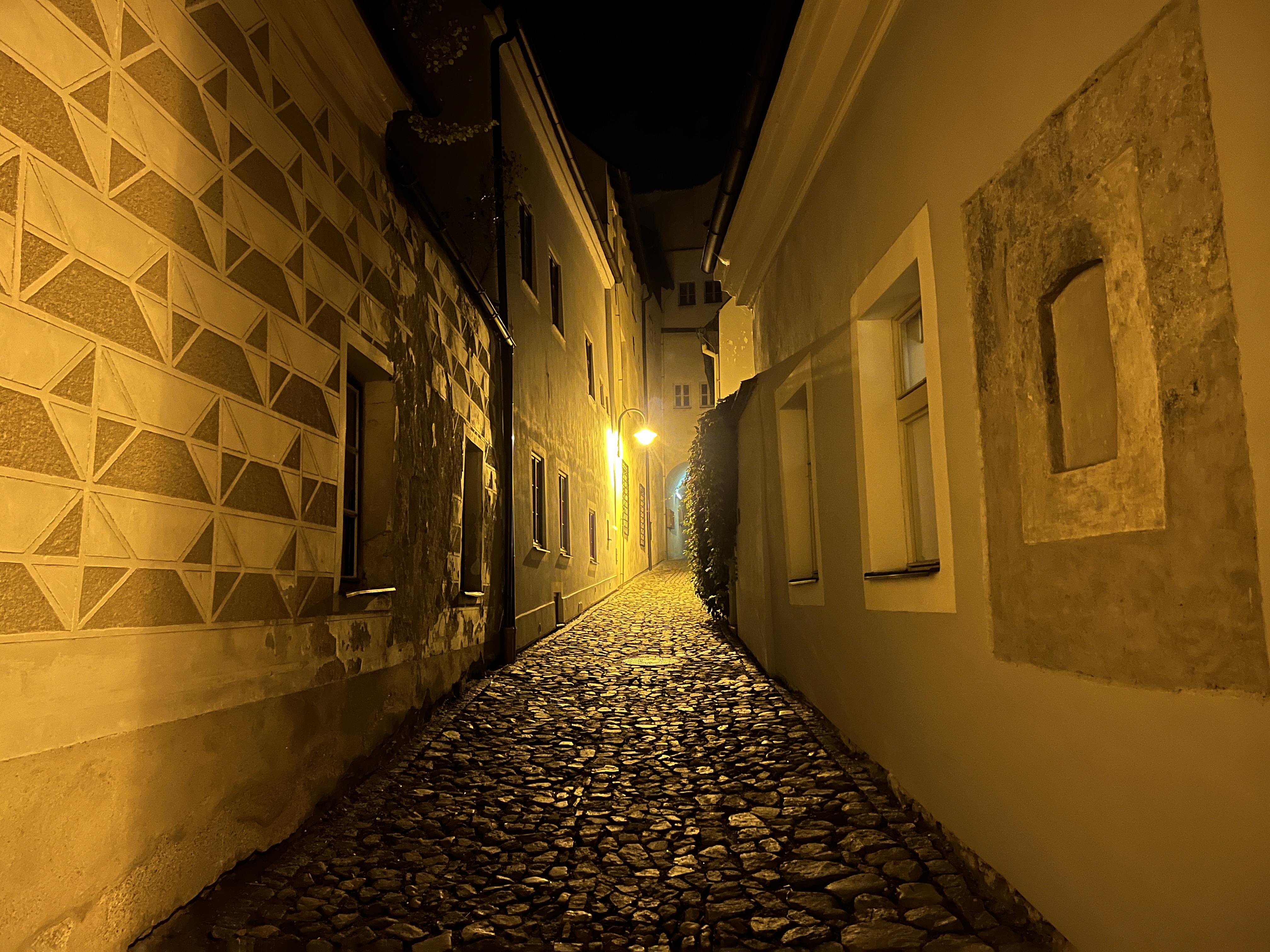 cobblestone alley at night
