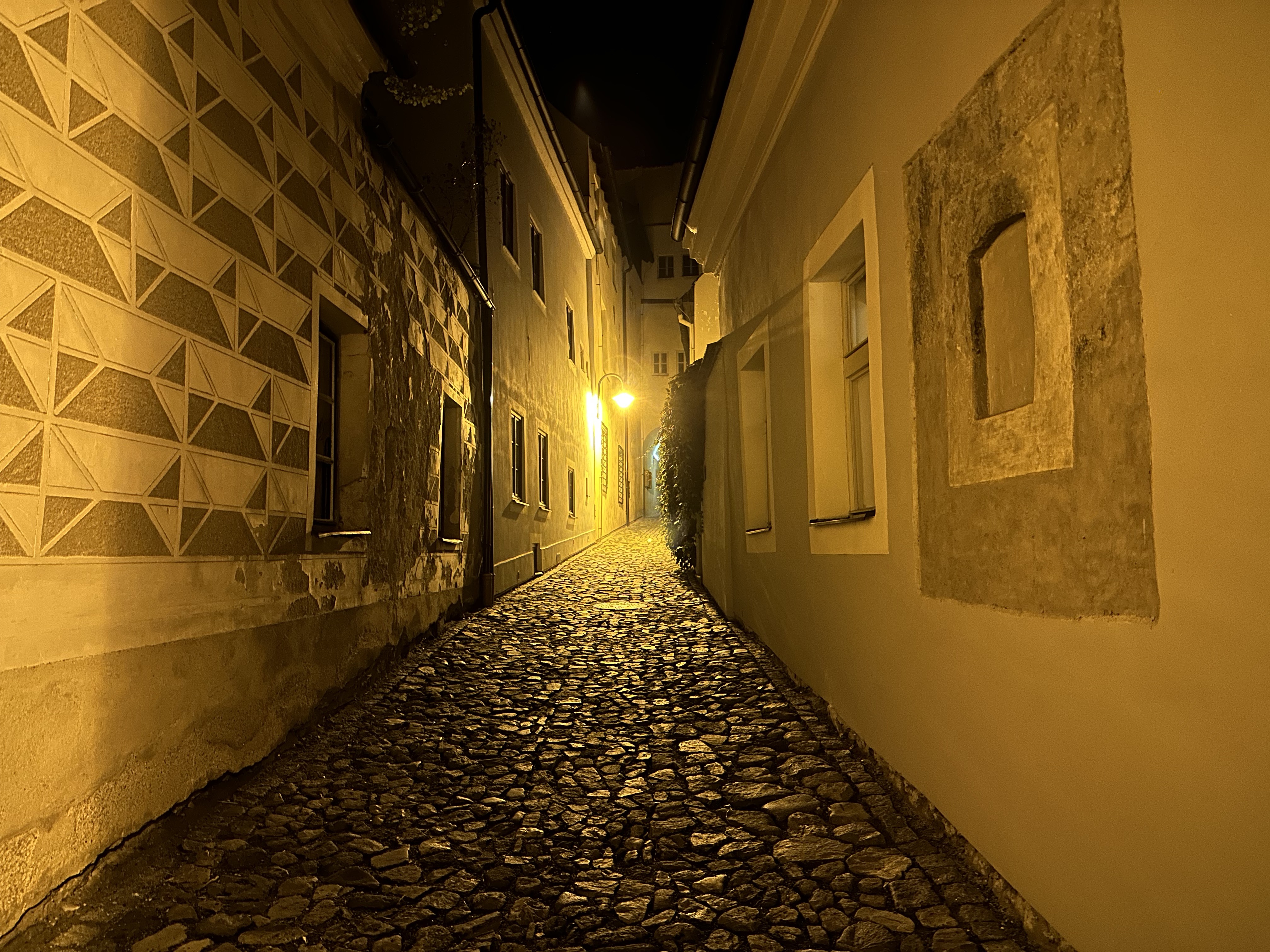 cobblestone alley night