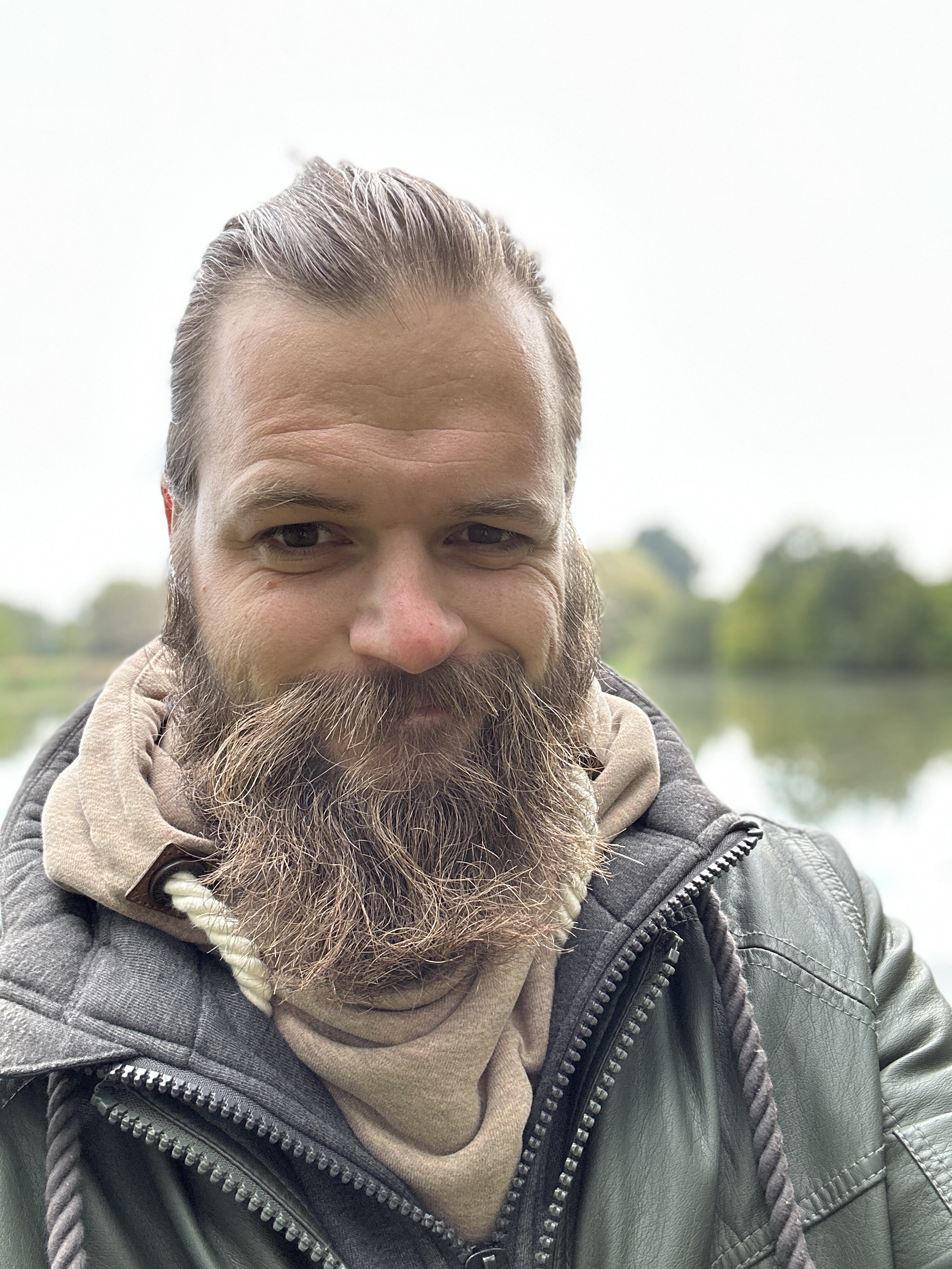 man smiling outdoors