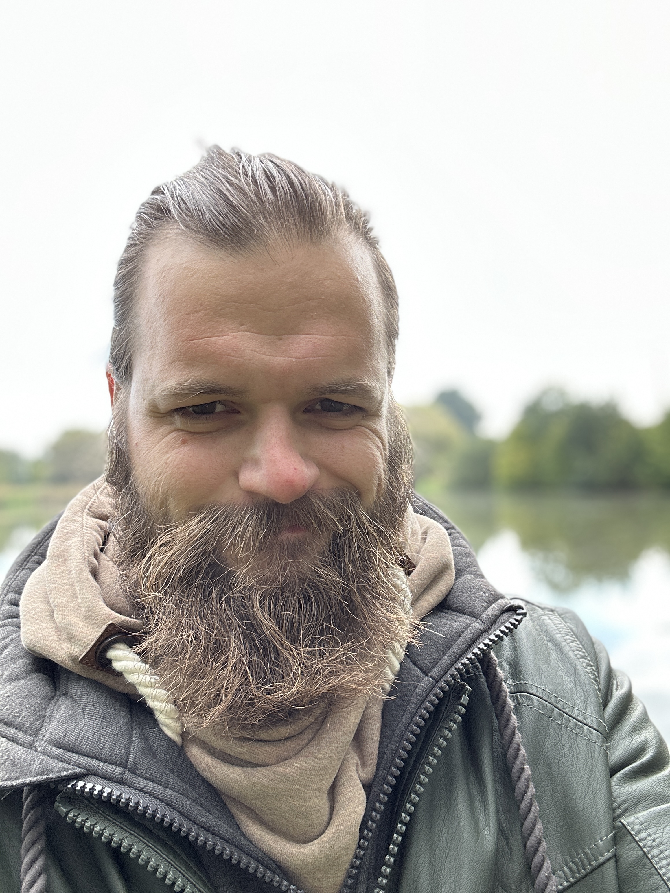 man with beard outdoors
