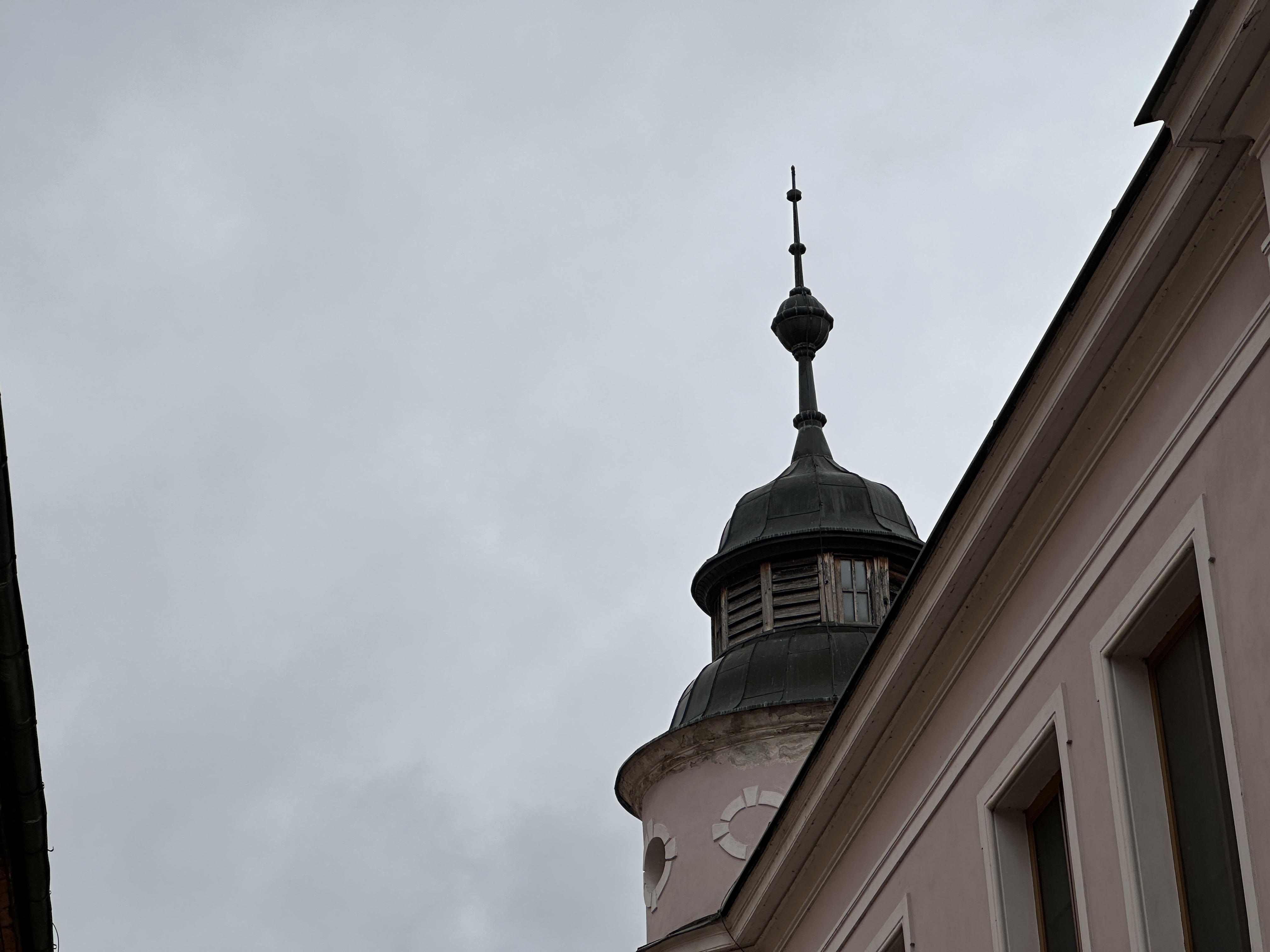 ornate tower against cloudy sky