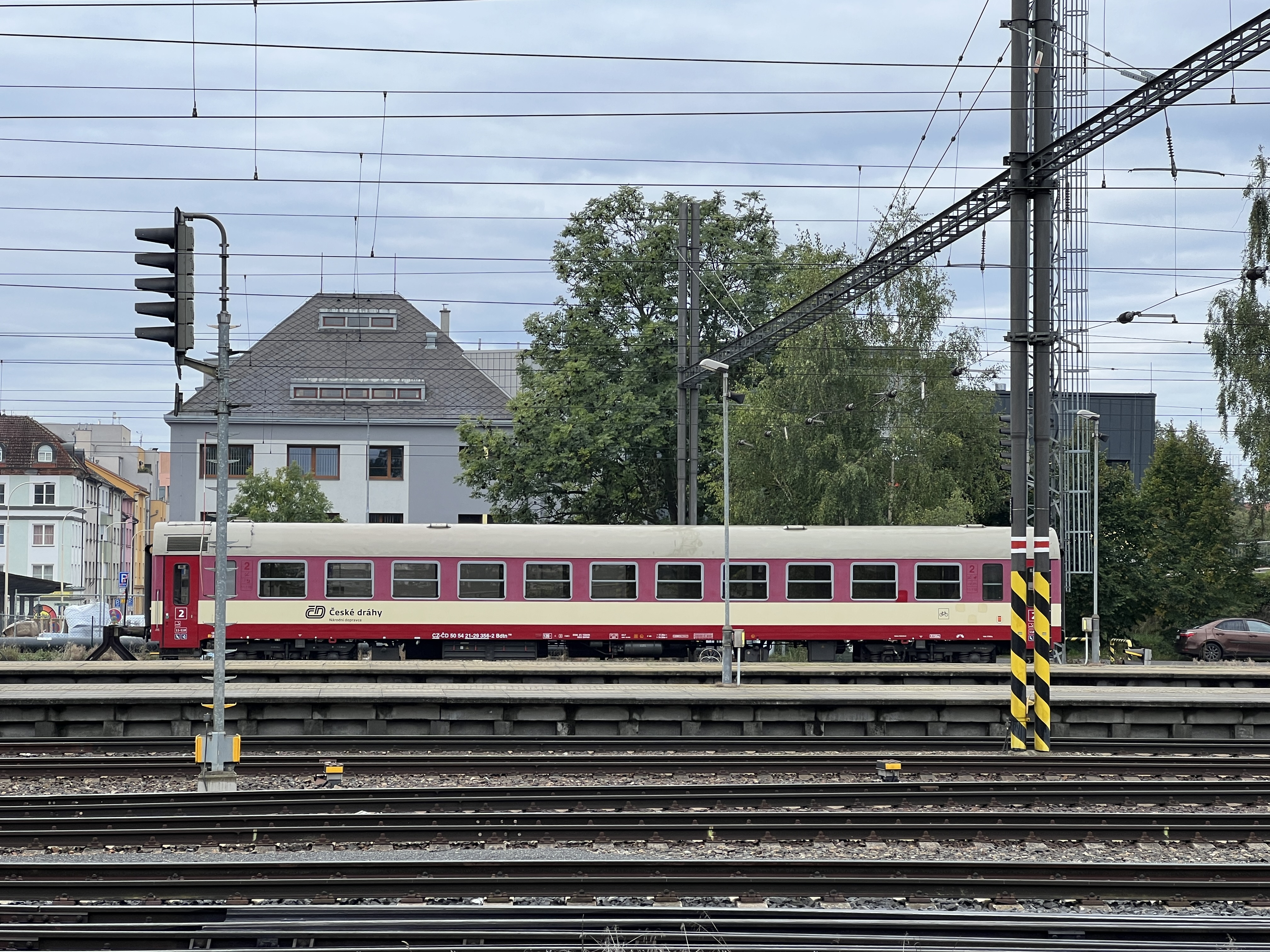 red train carriage at station