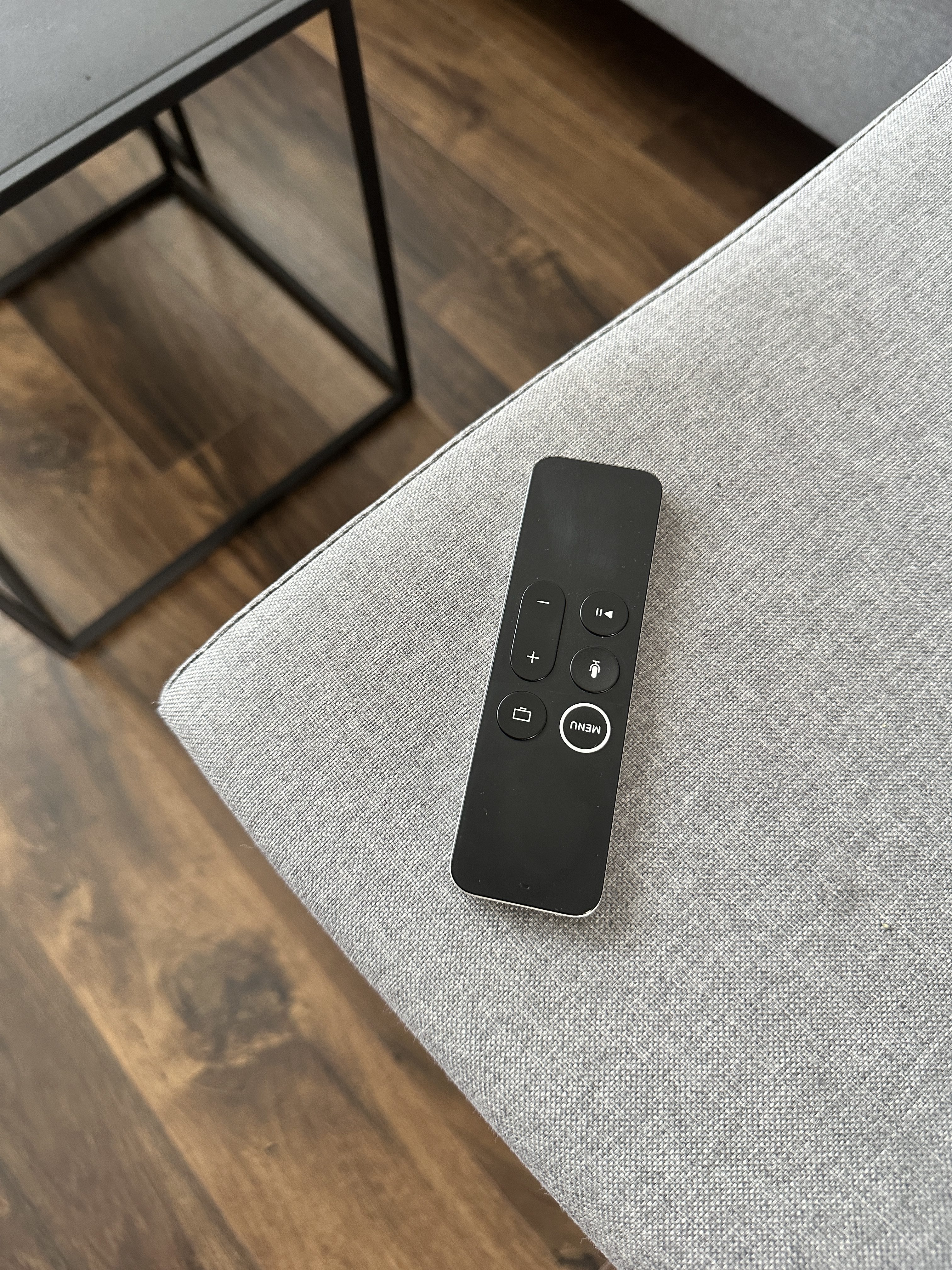 remote control on grey sofa