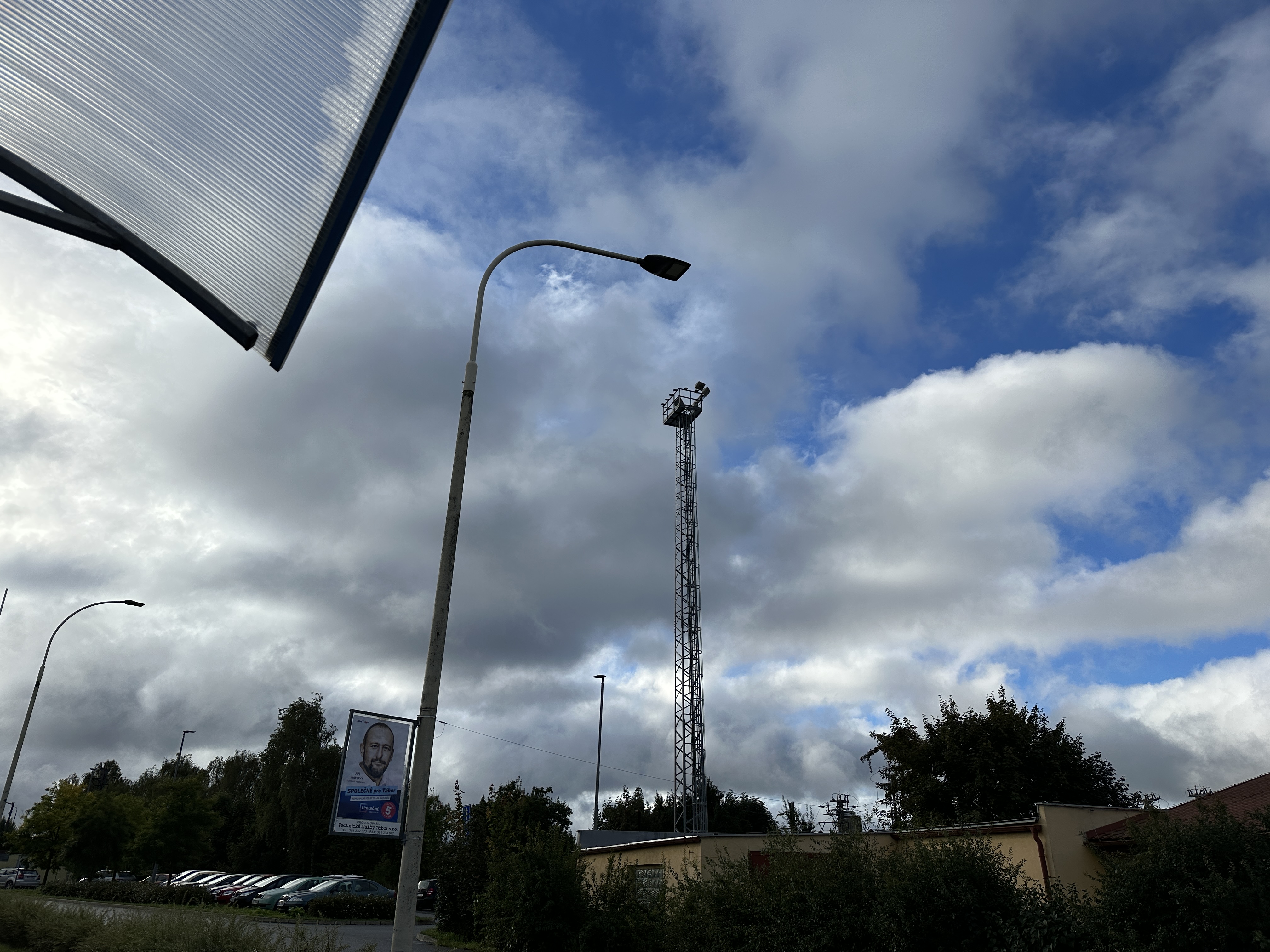 street lamp tower clouds