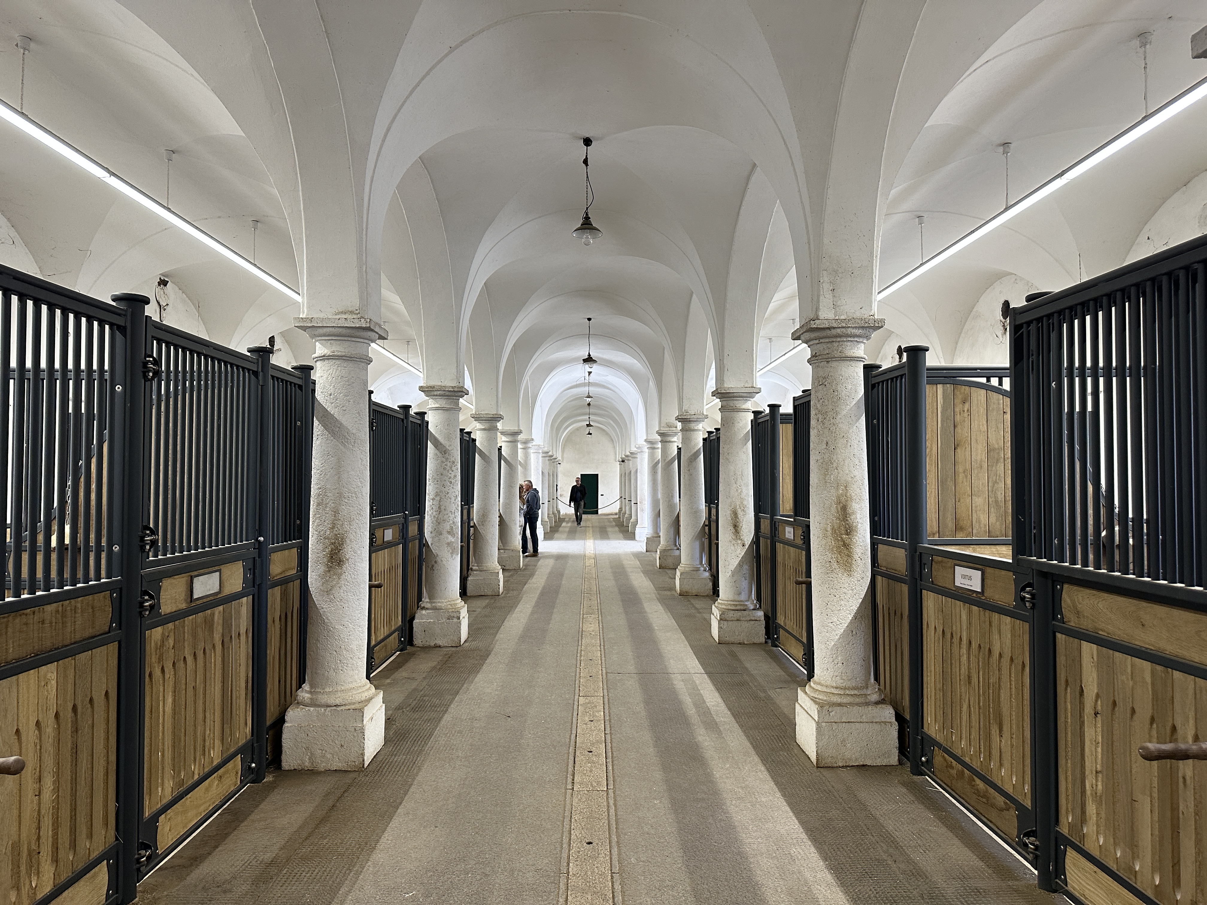 arched hallway with stables