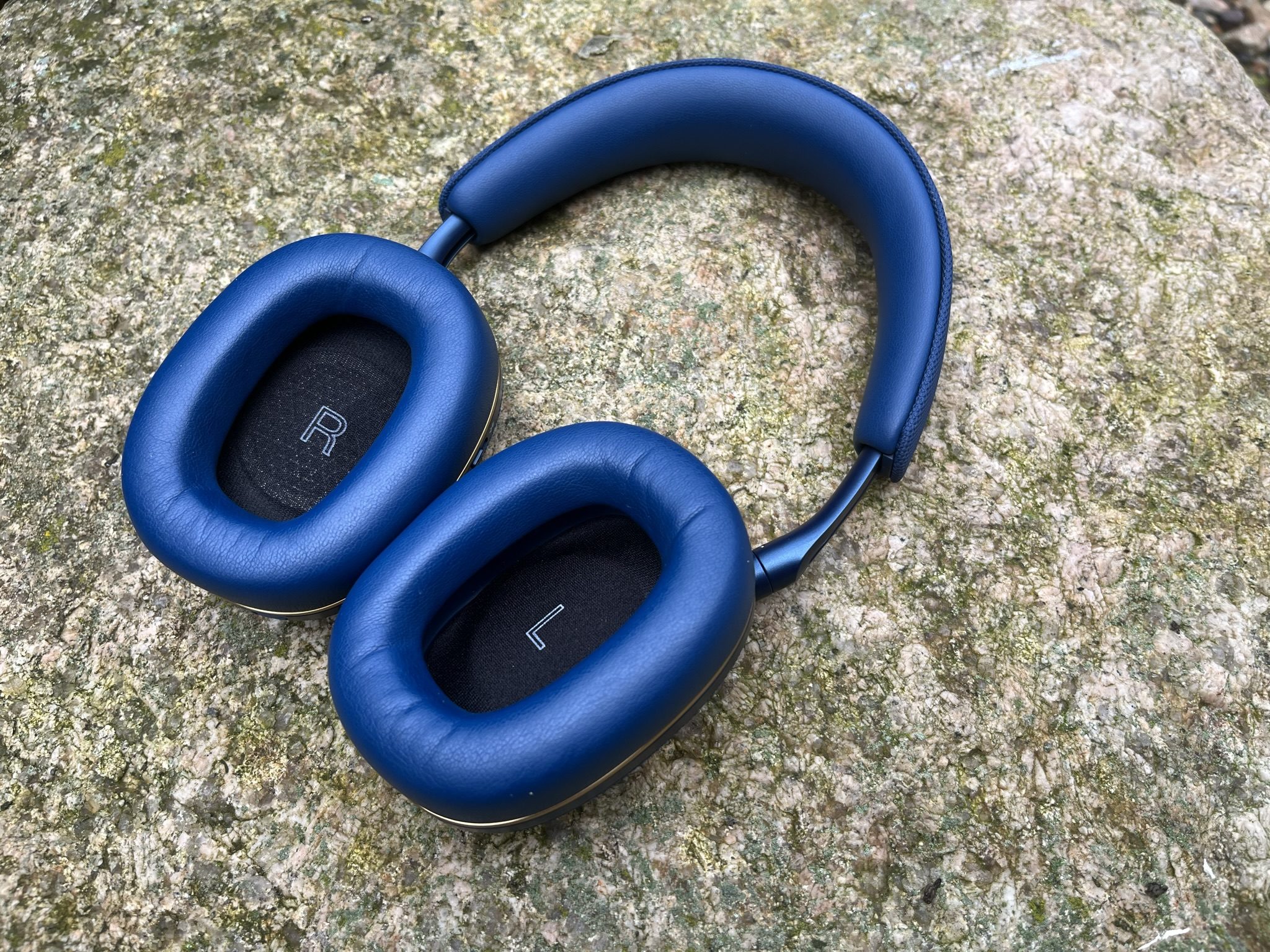 blue headphones on rock