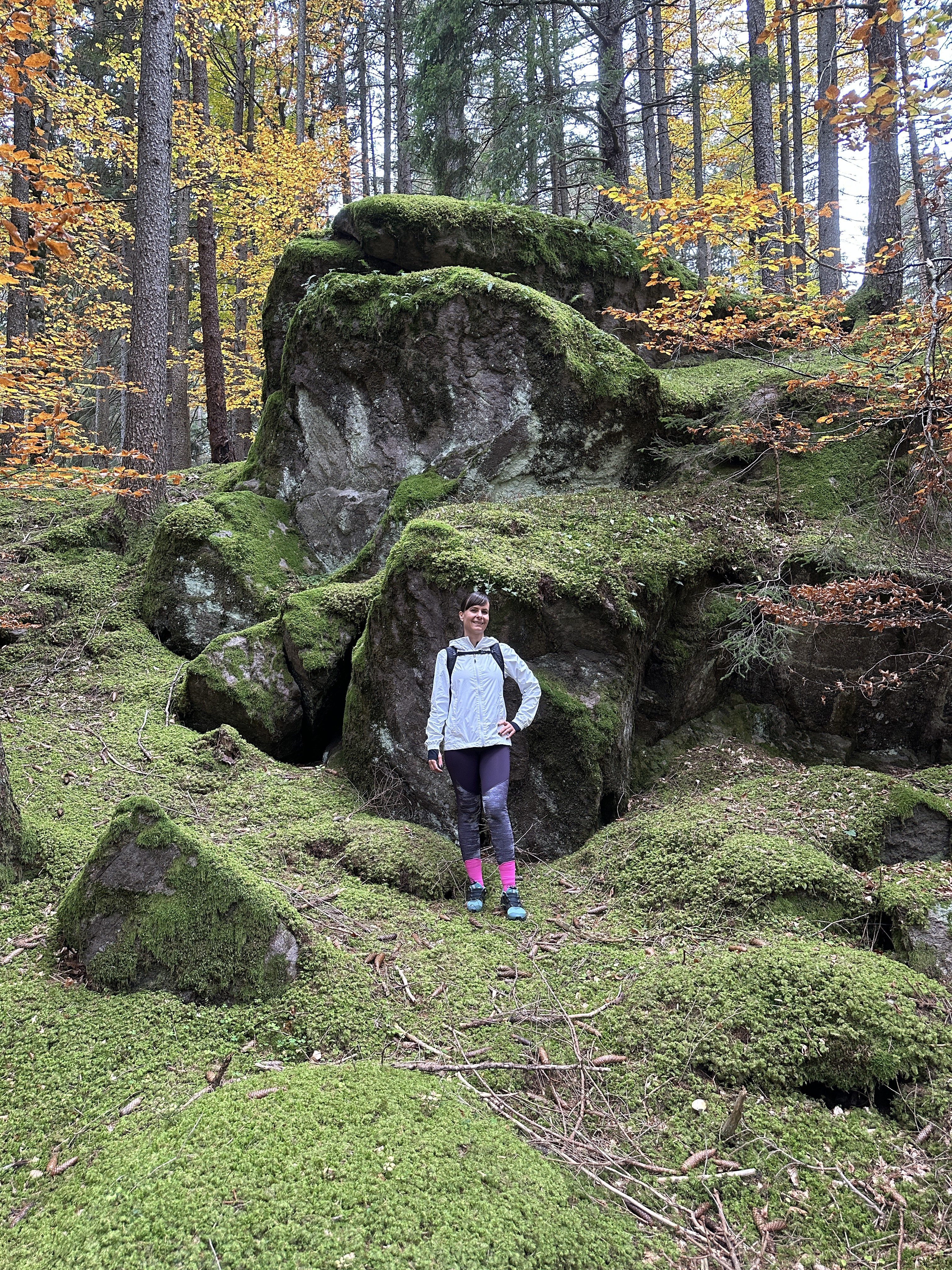 hiker on mossy rocks
