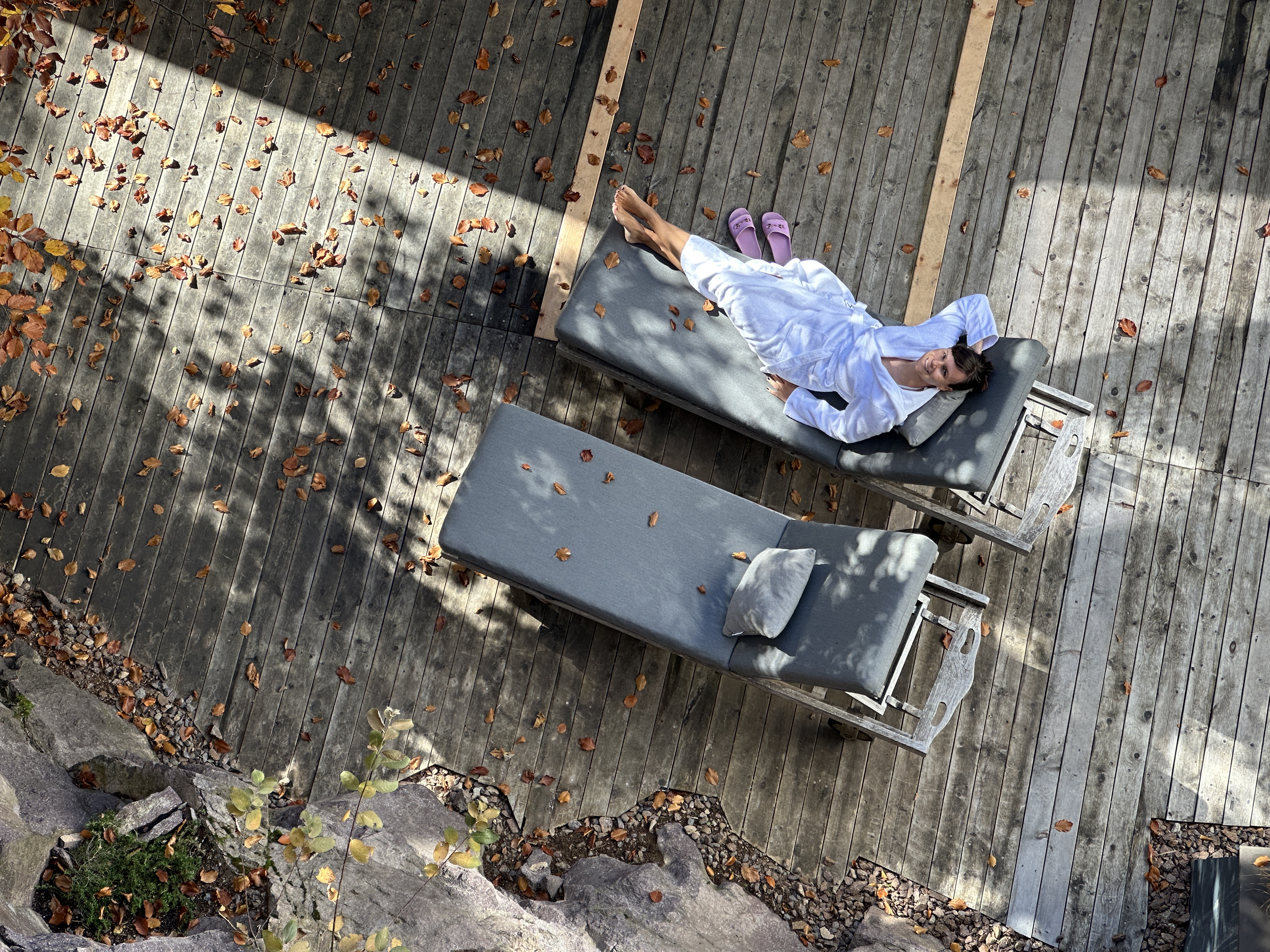 person relaxing deck chairs