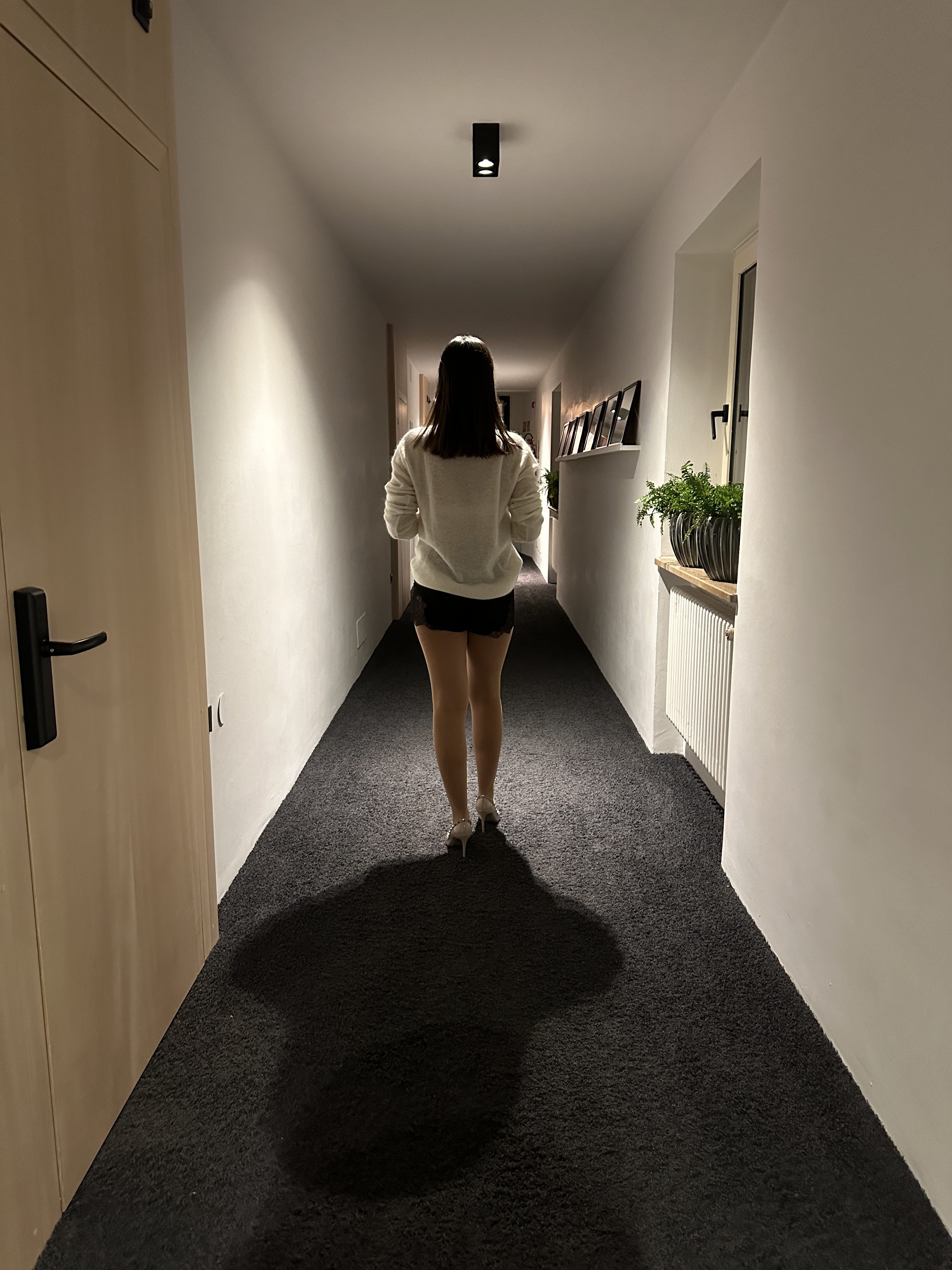 person walking hallway