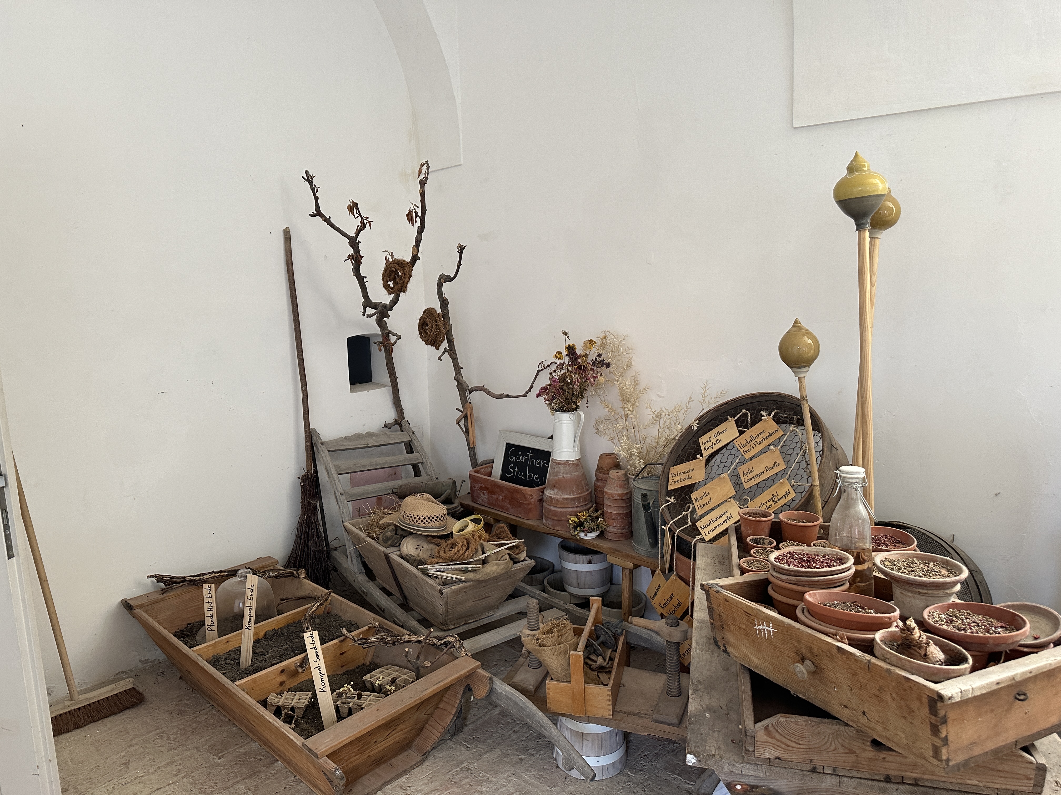 rustic garden tools and pots display
