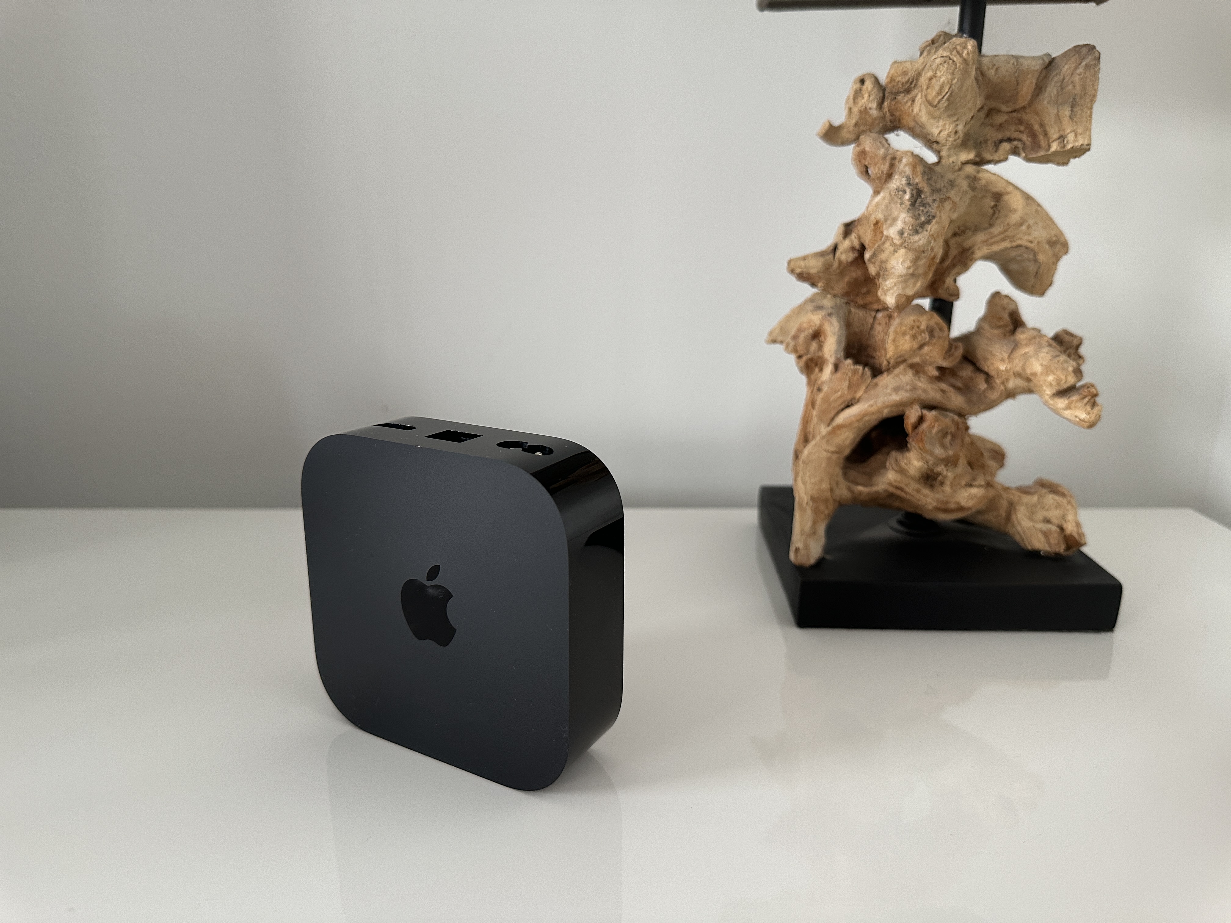 apple tv device wooden sculpture