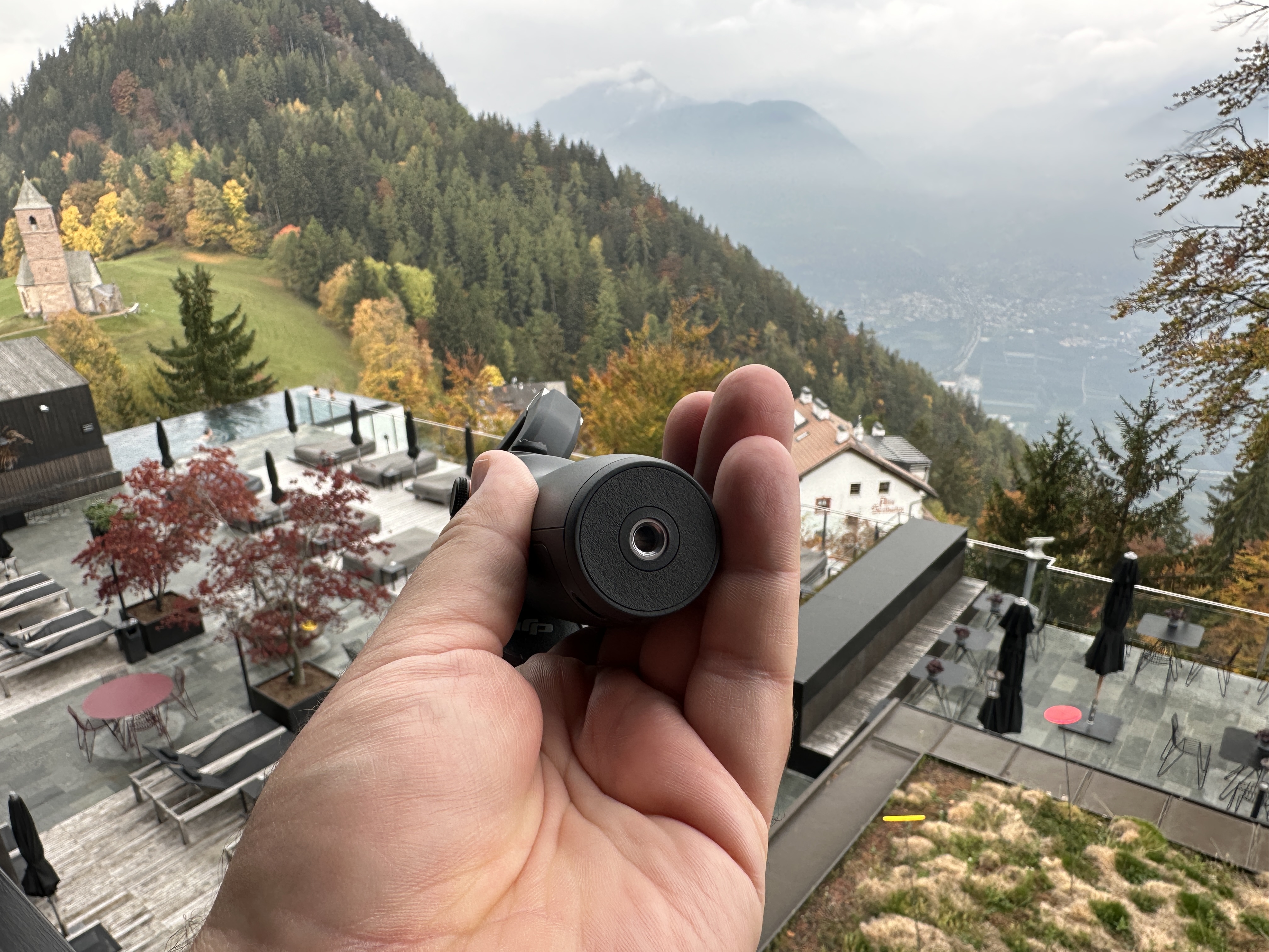 hand holding device mountain view