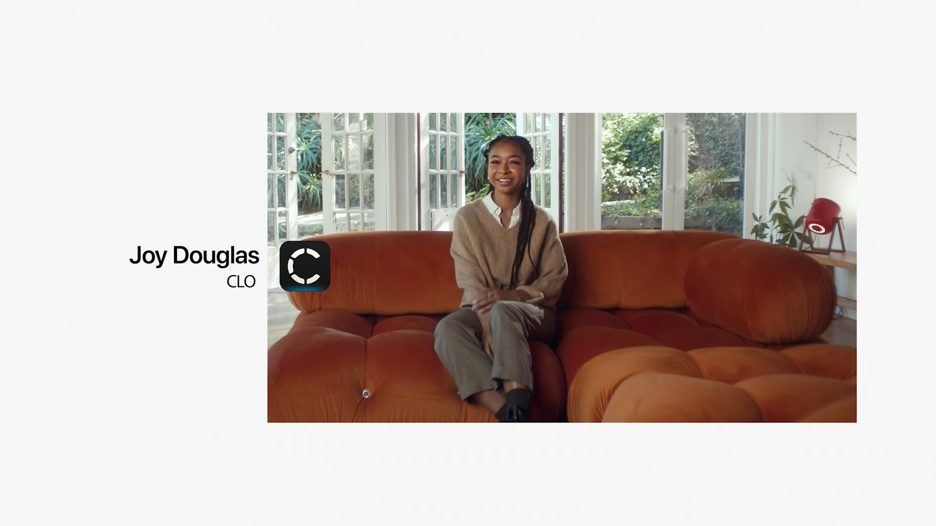 person on orange sofa with clo logo
