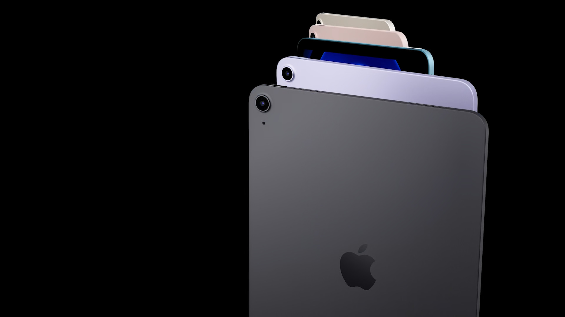 stacked ipads on black background