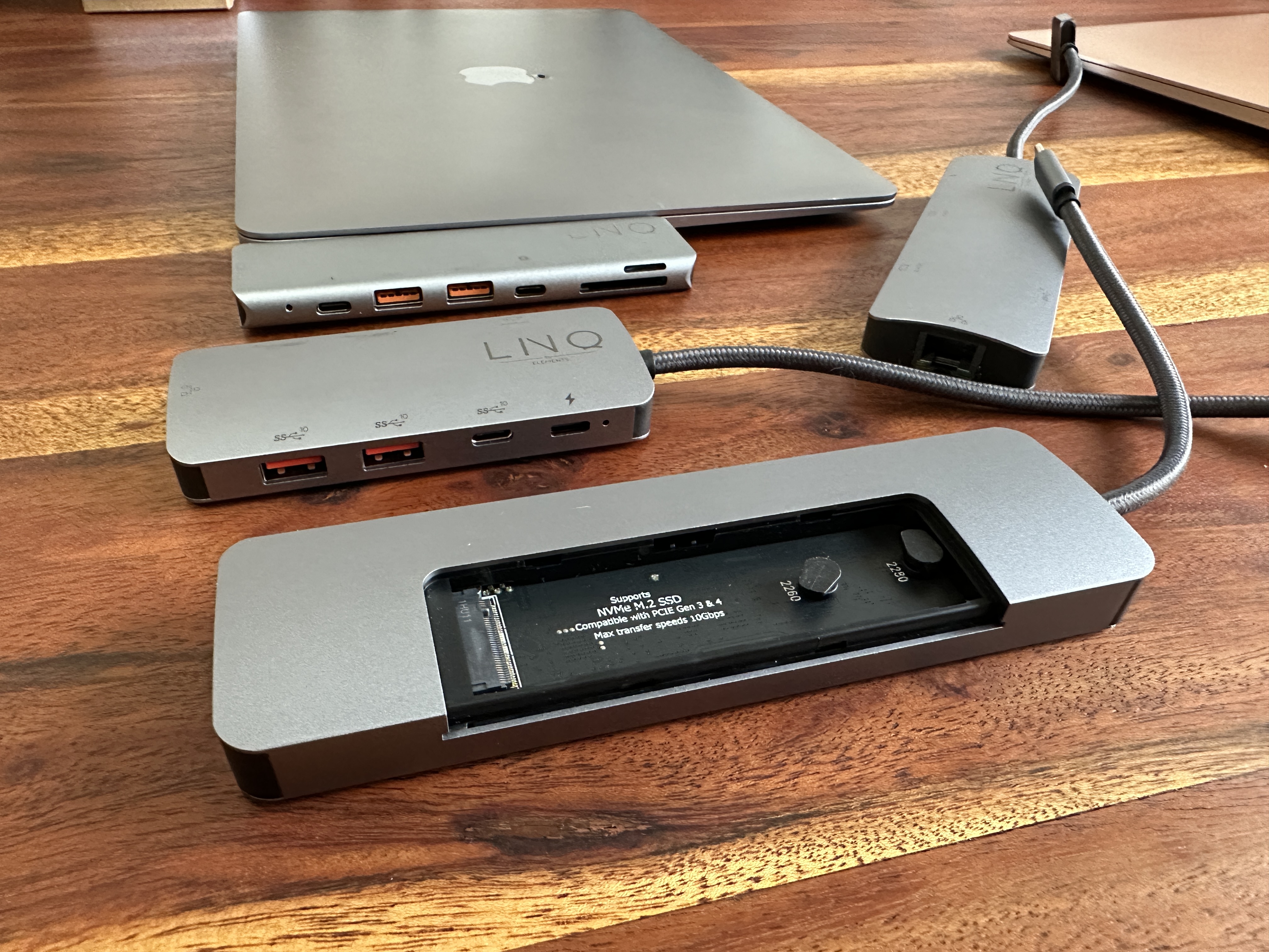 usb c hub and laptop on wooden table