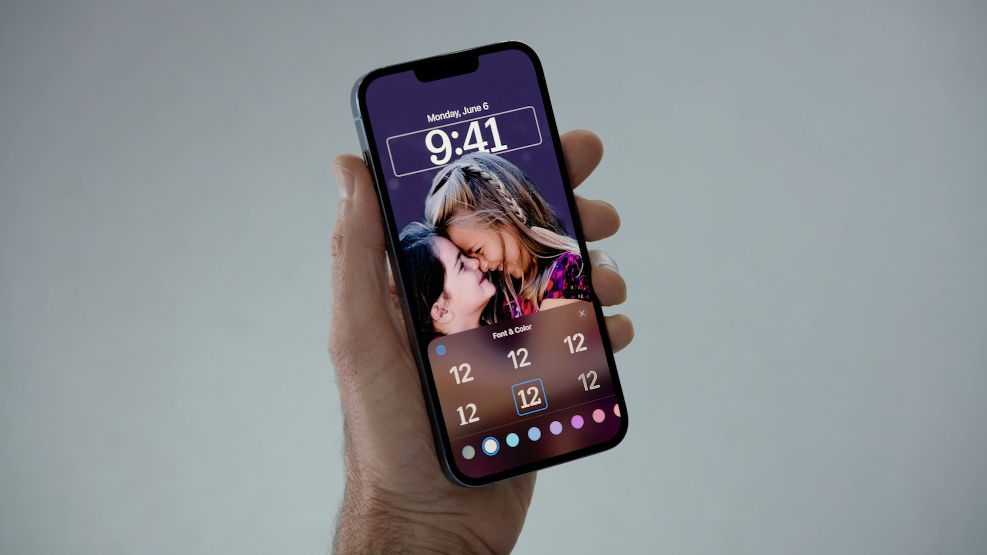 hand holding smartphone lock screen