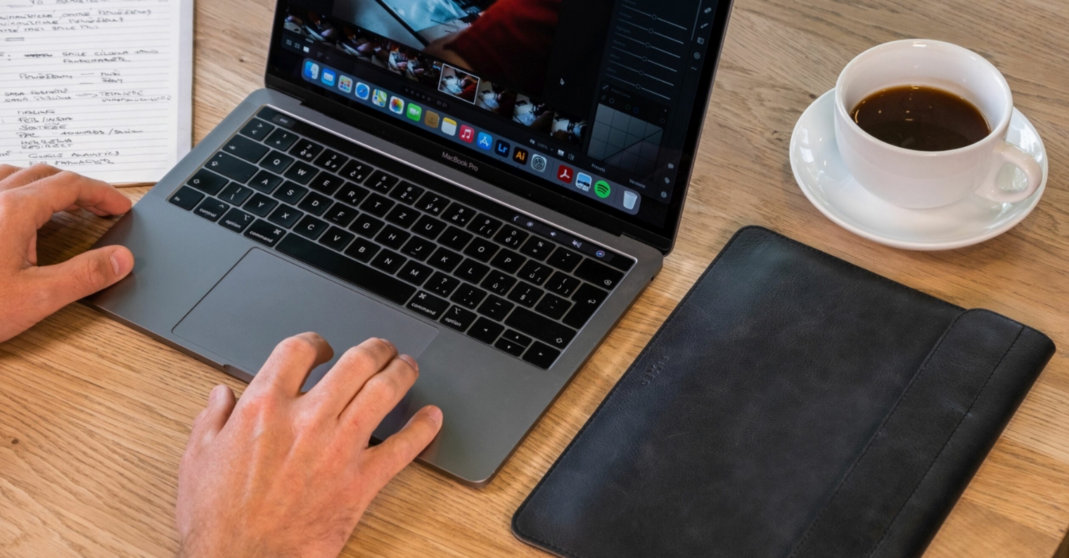 working on laptop with coffee