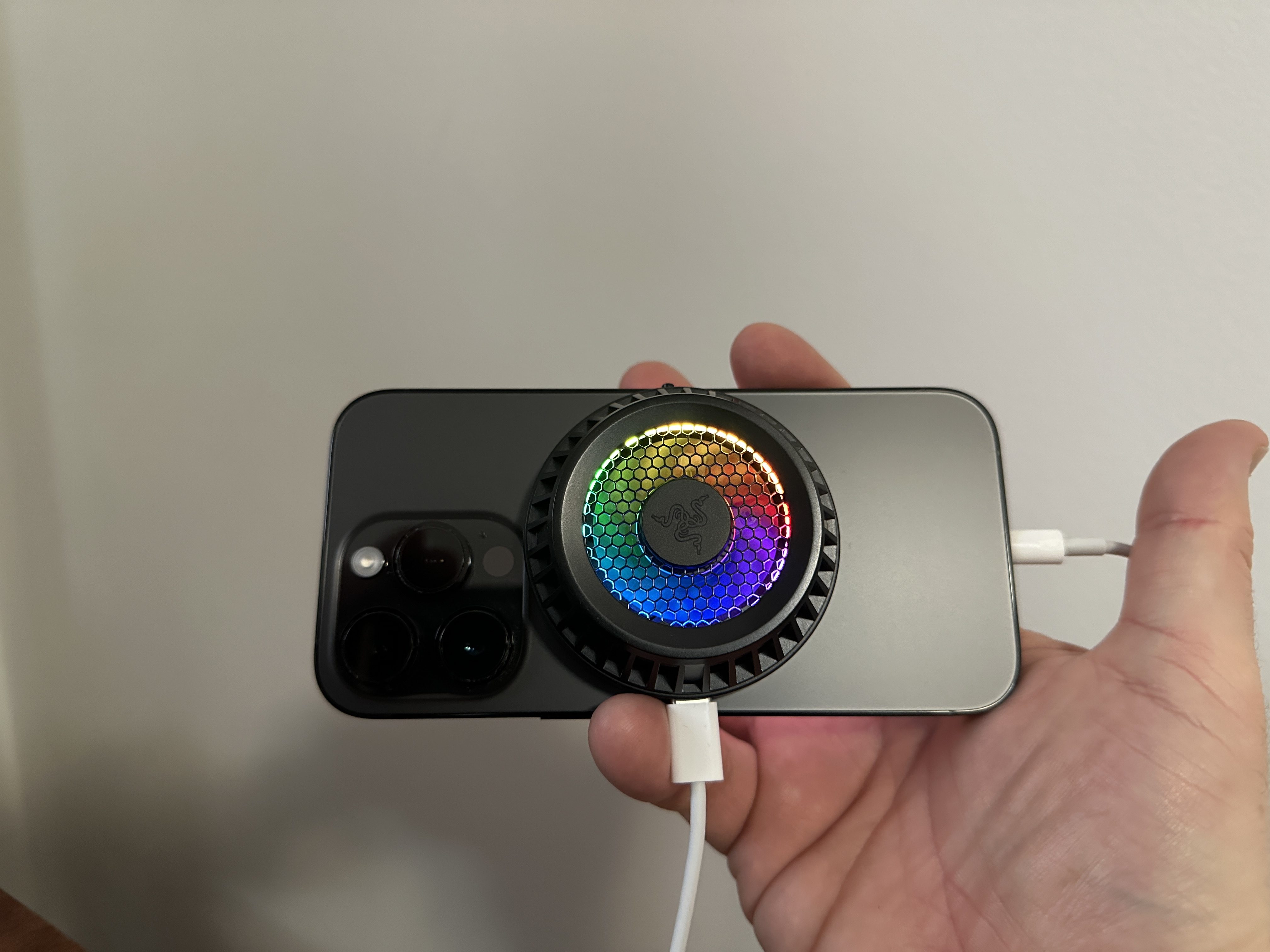 hand holding phone with cooler