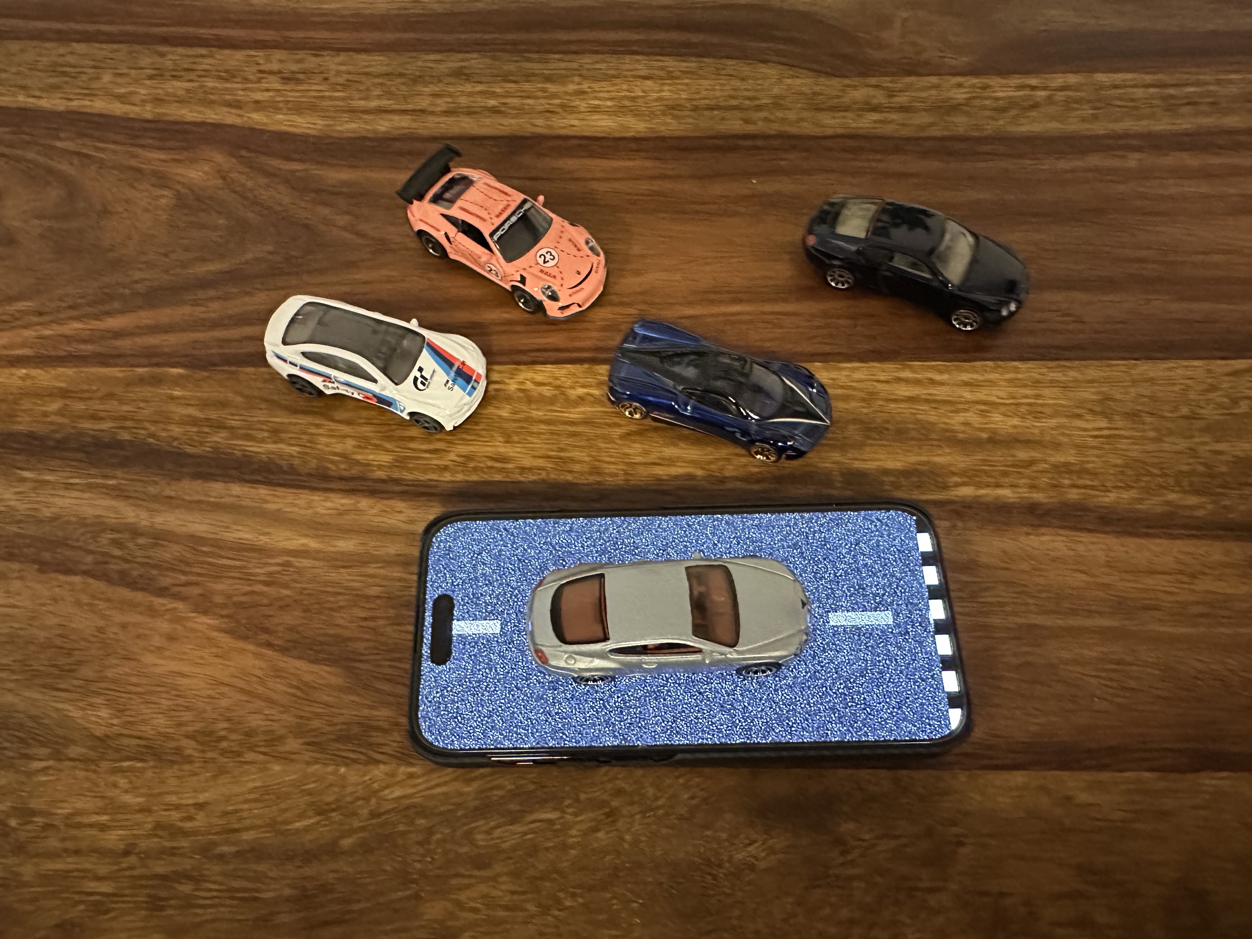 mini cars on phone orange car