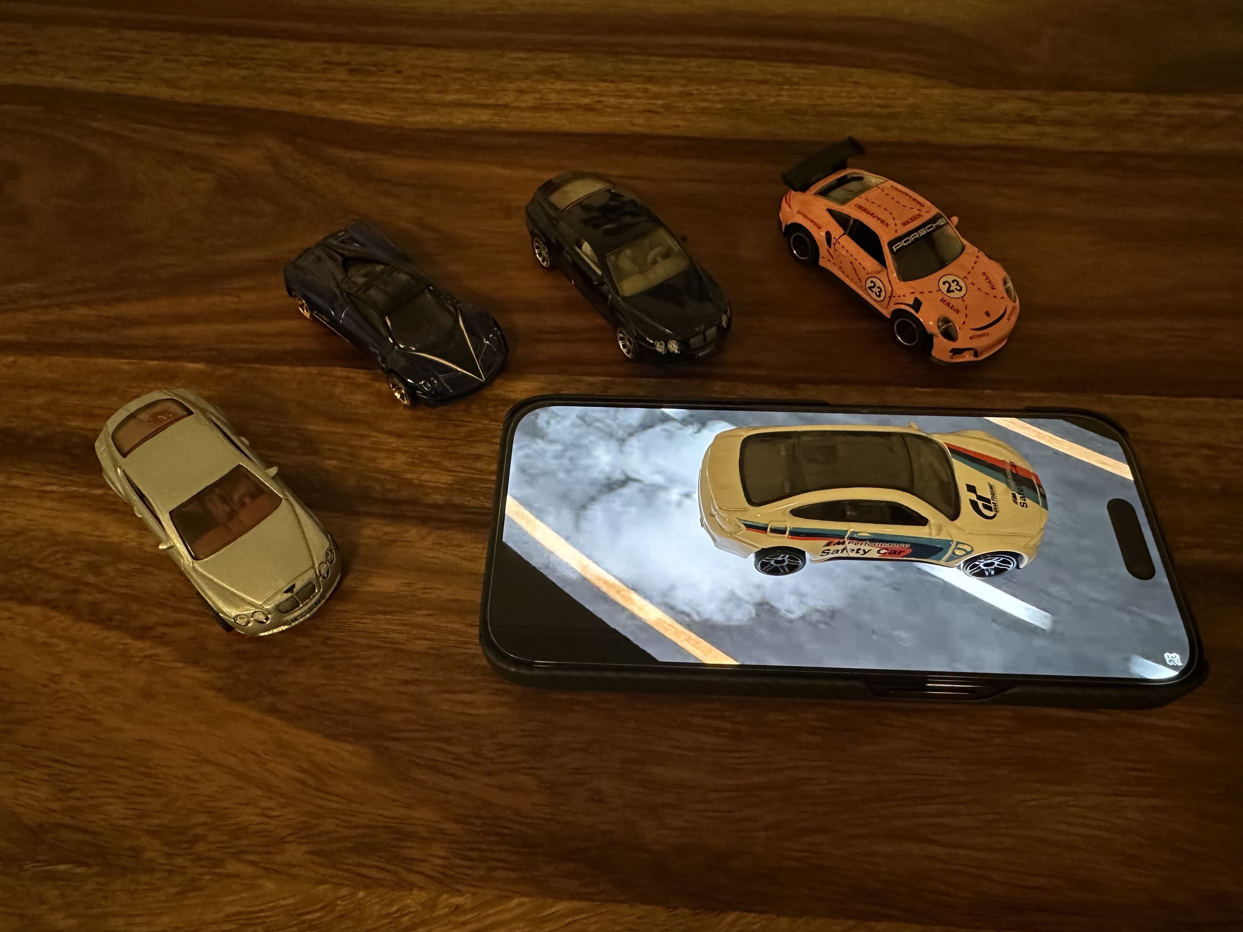 mini cars on phone screen