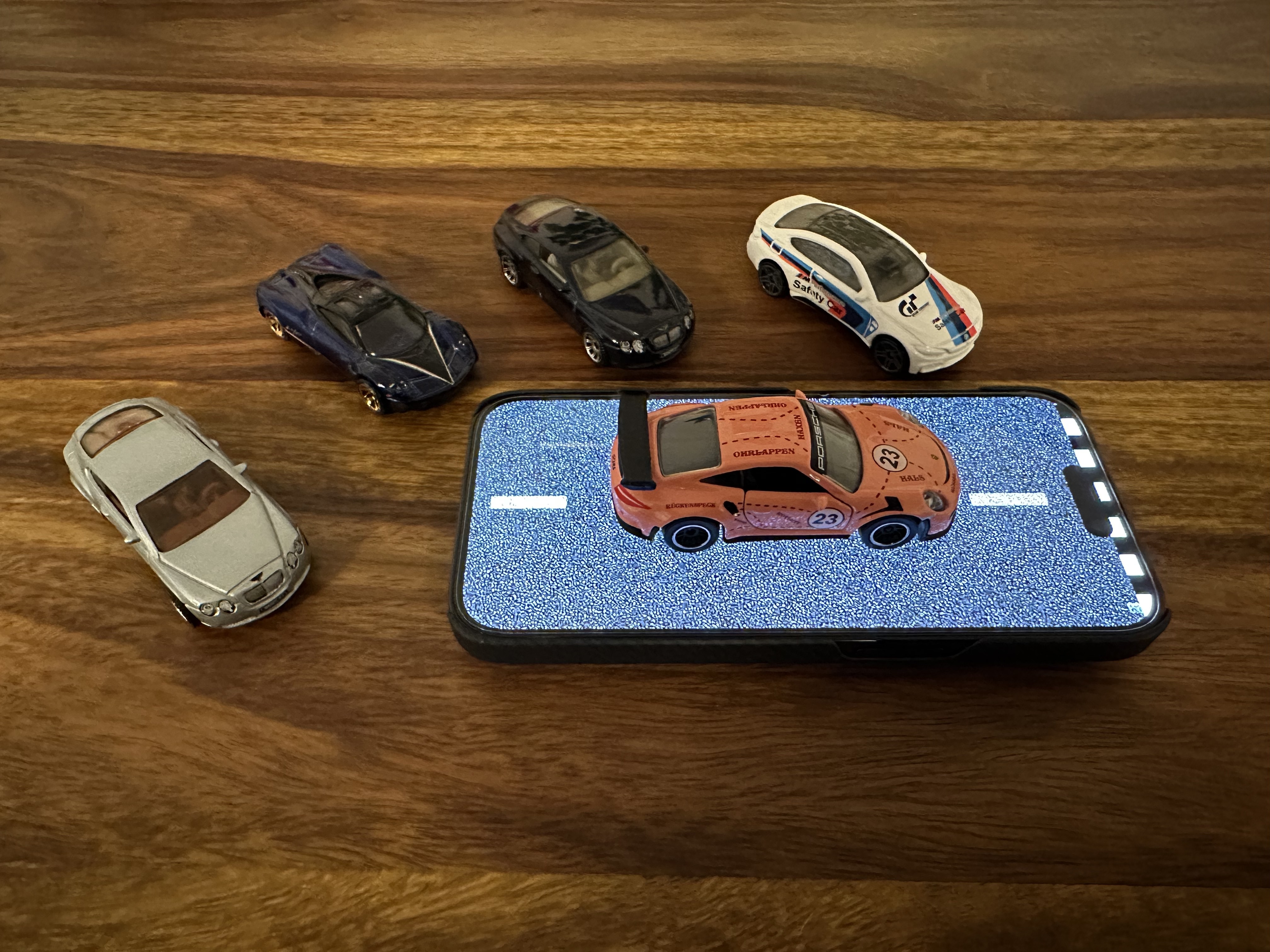 mini cars on phone static screen