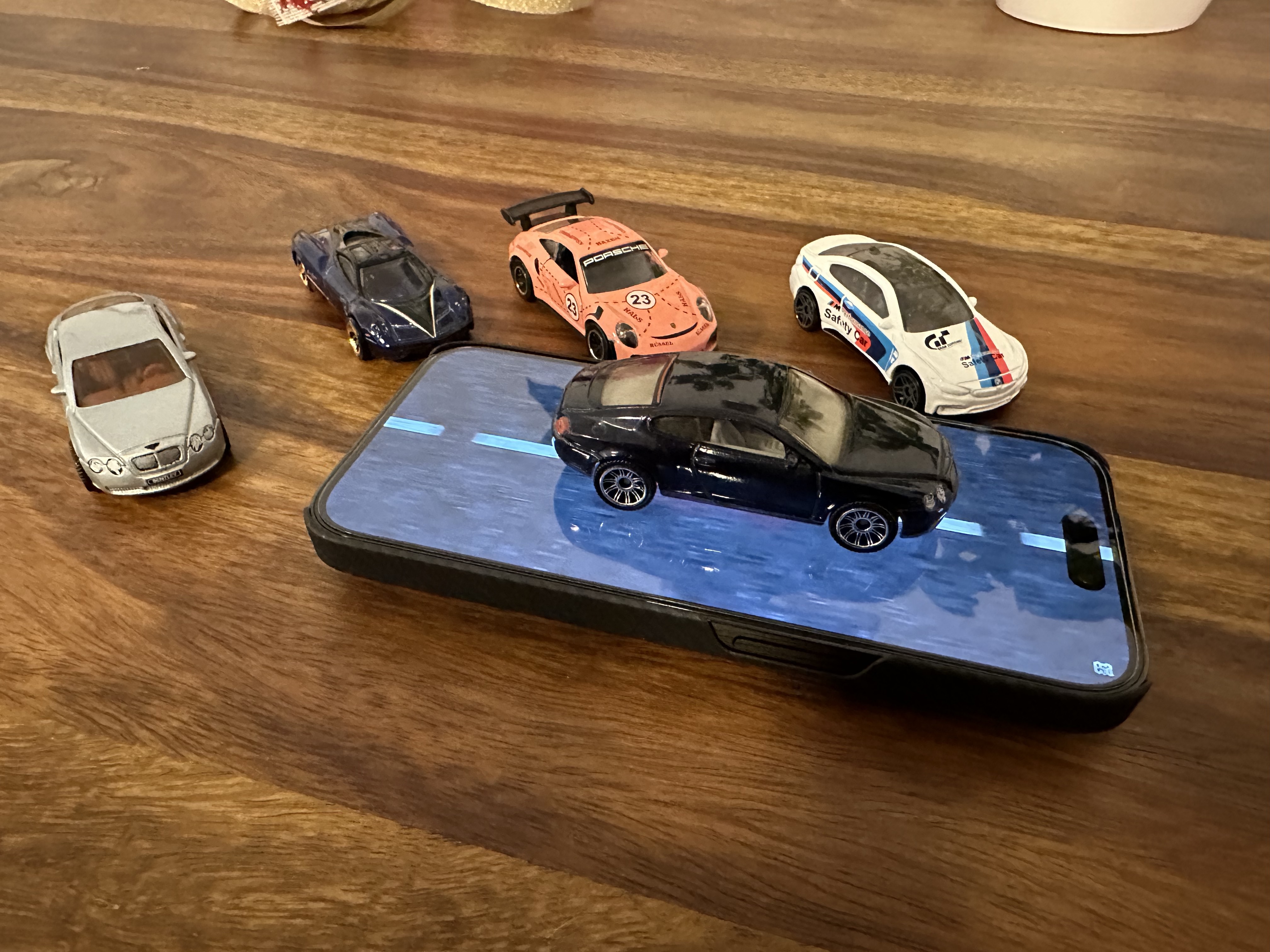 mini cars on phone top view