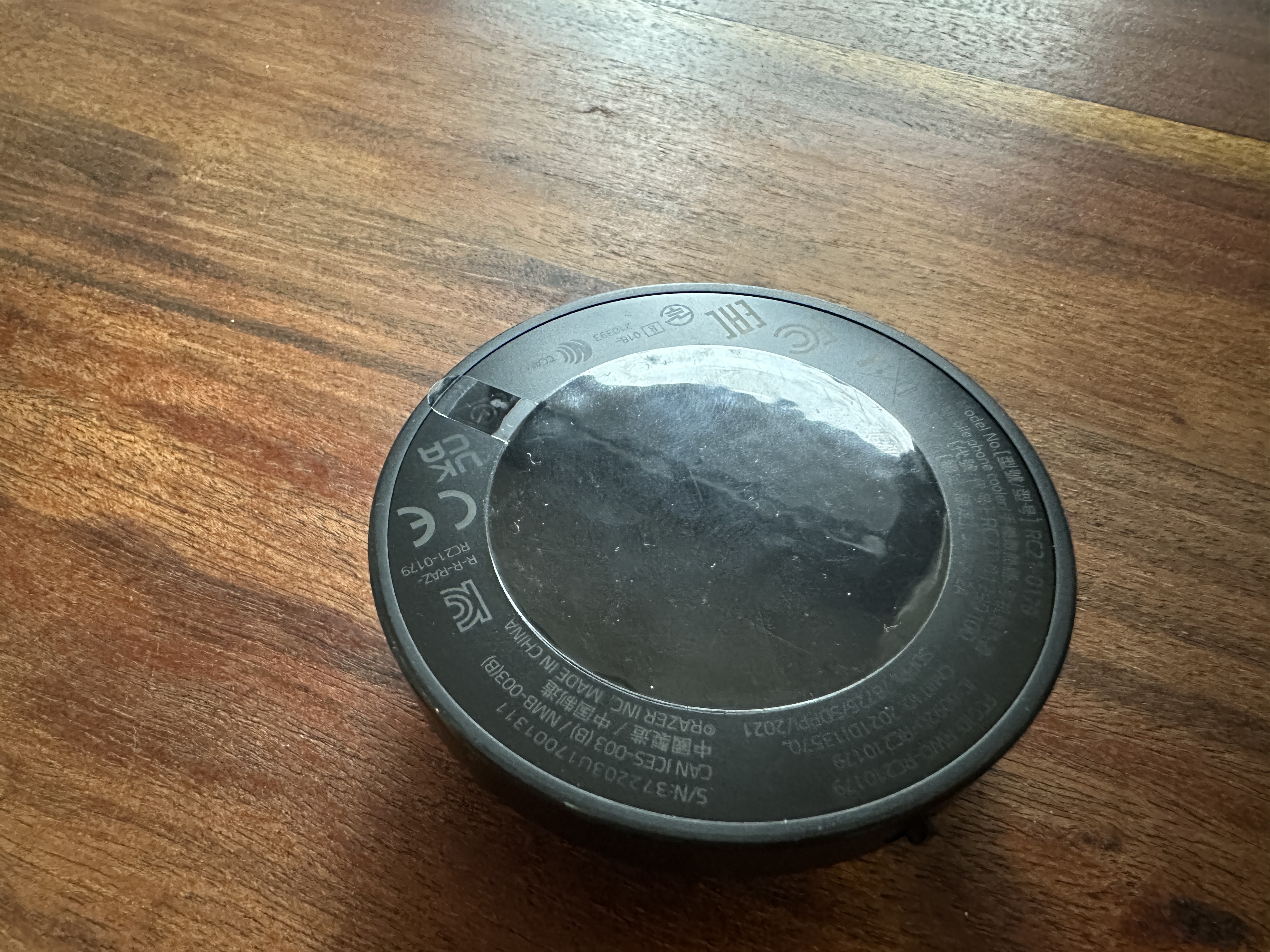 round device on wooden surface