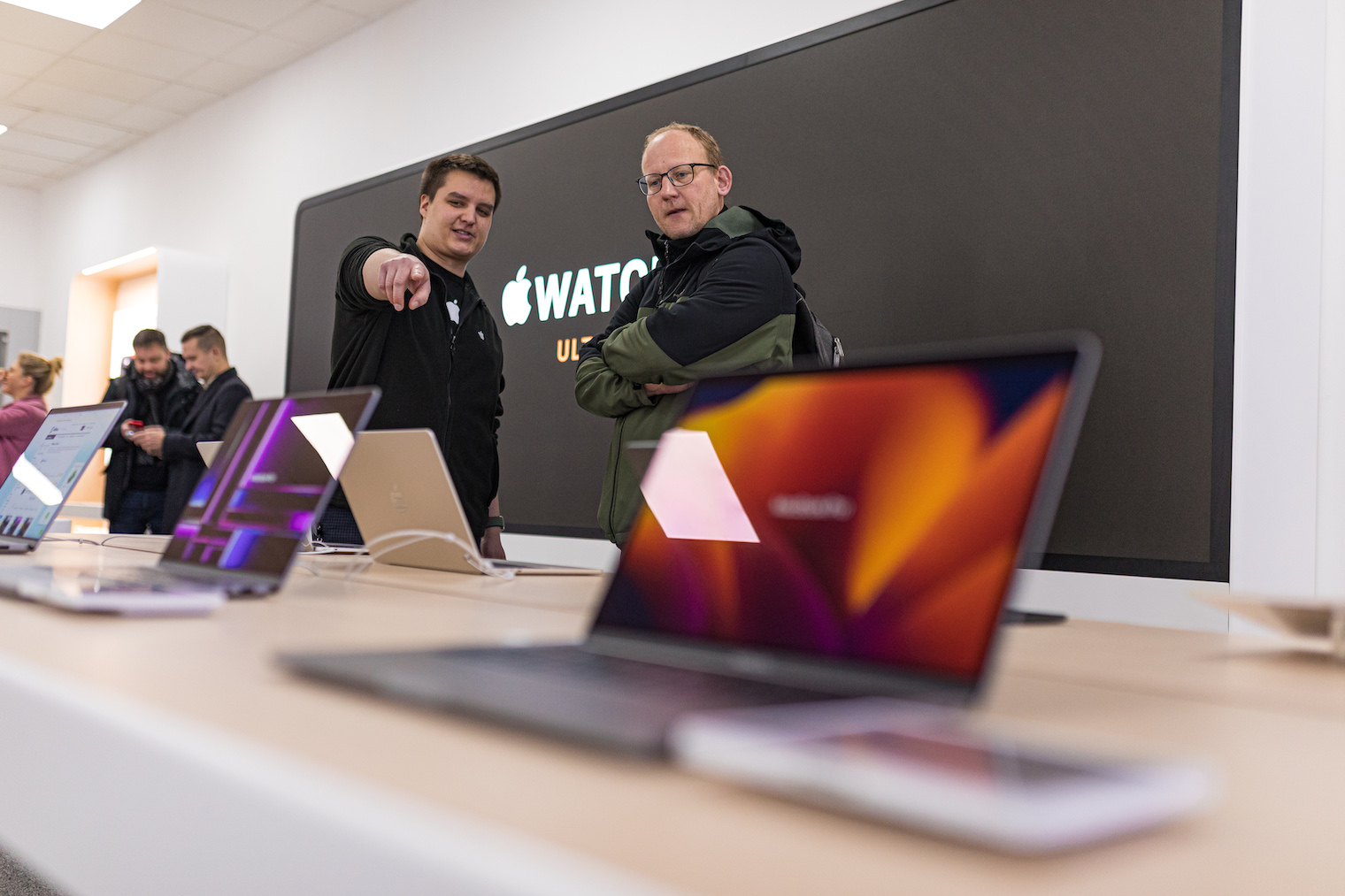 customers exploring laptops