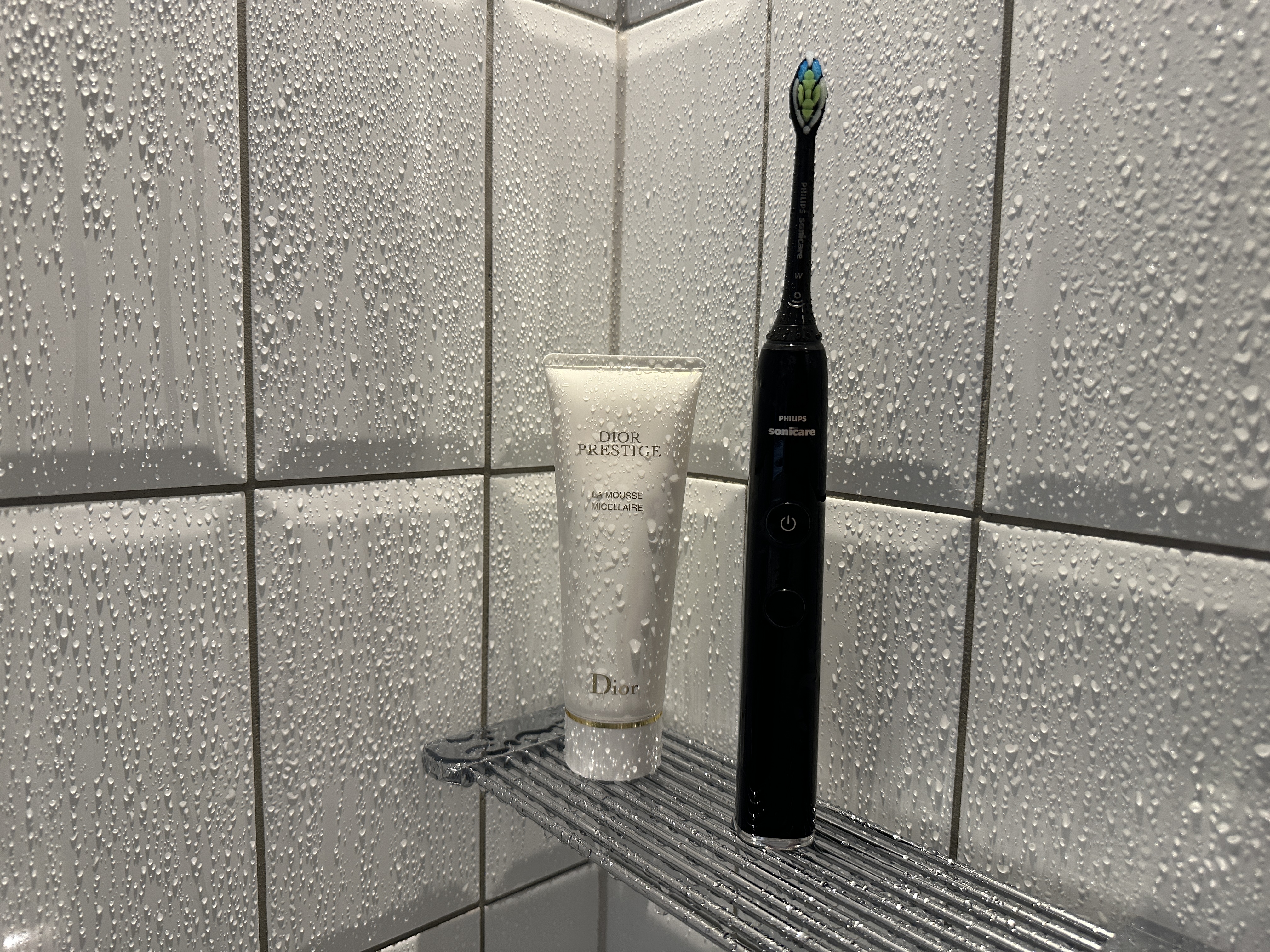 shower shelf with toothbrush and cream