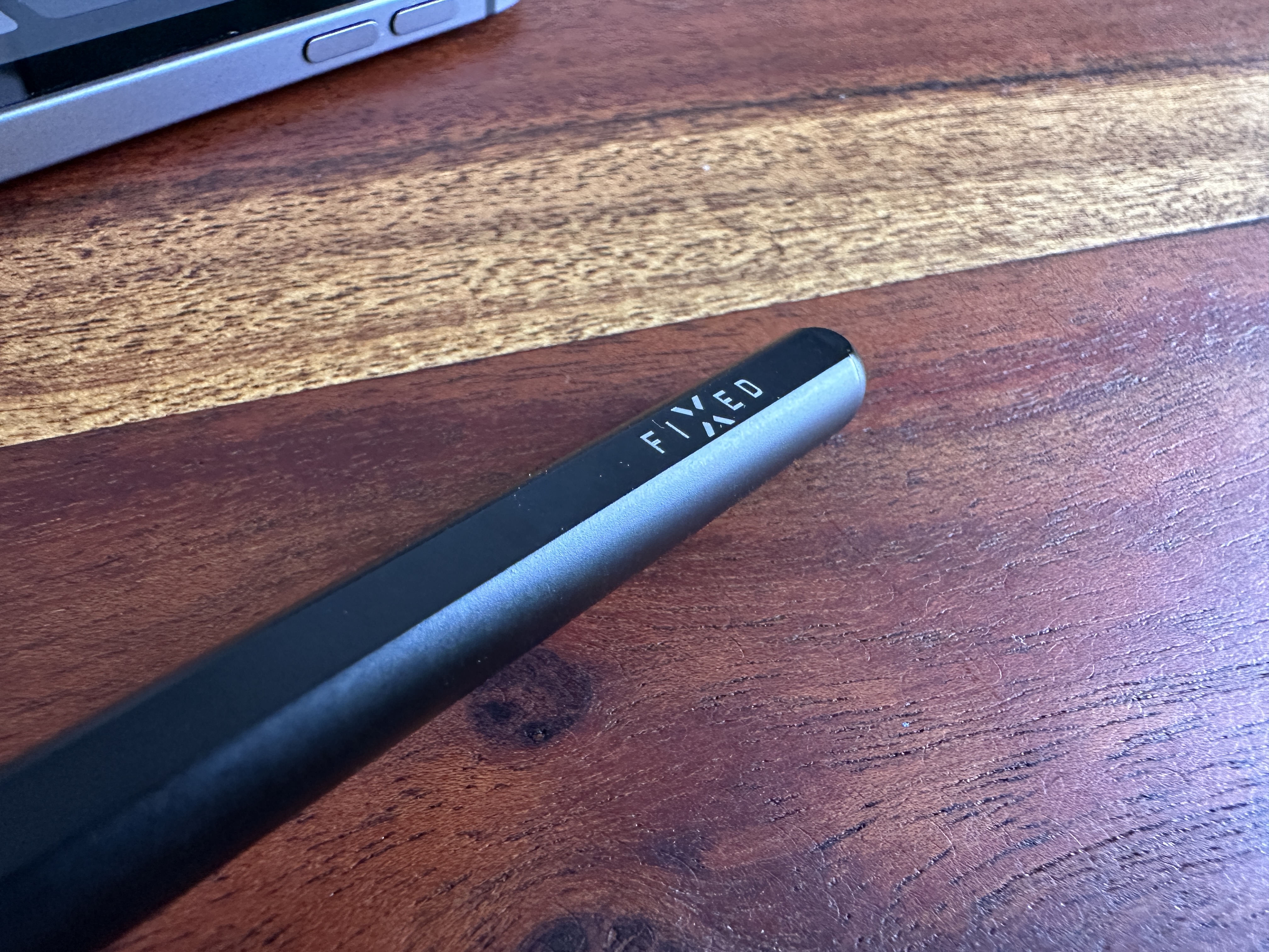 stylus on wooden table