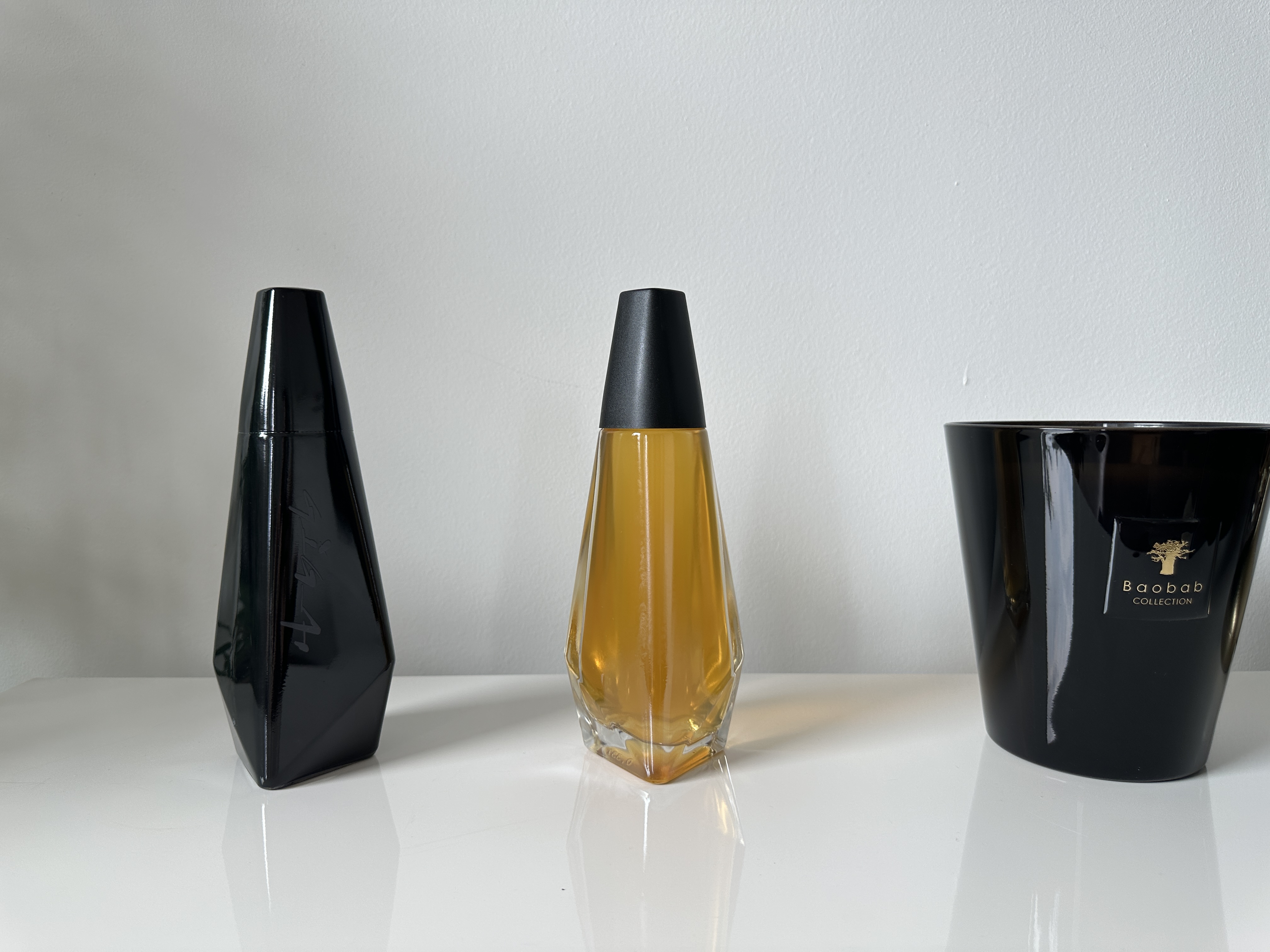 black and clear bottles on table