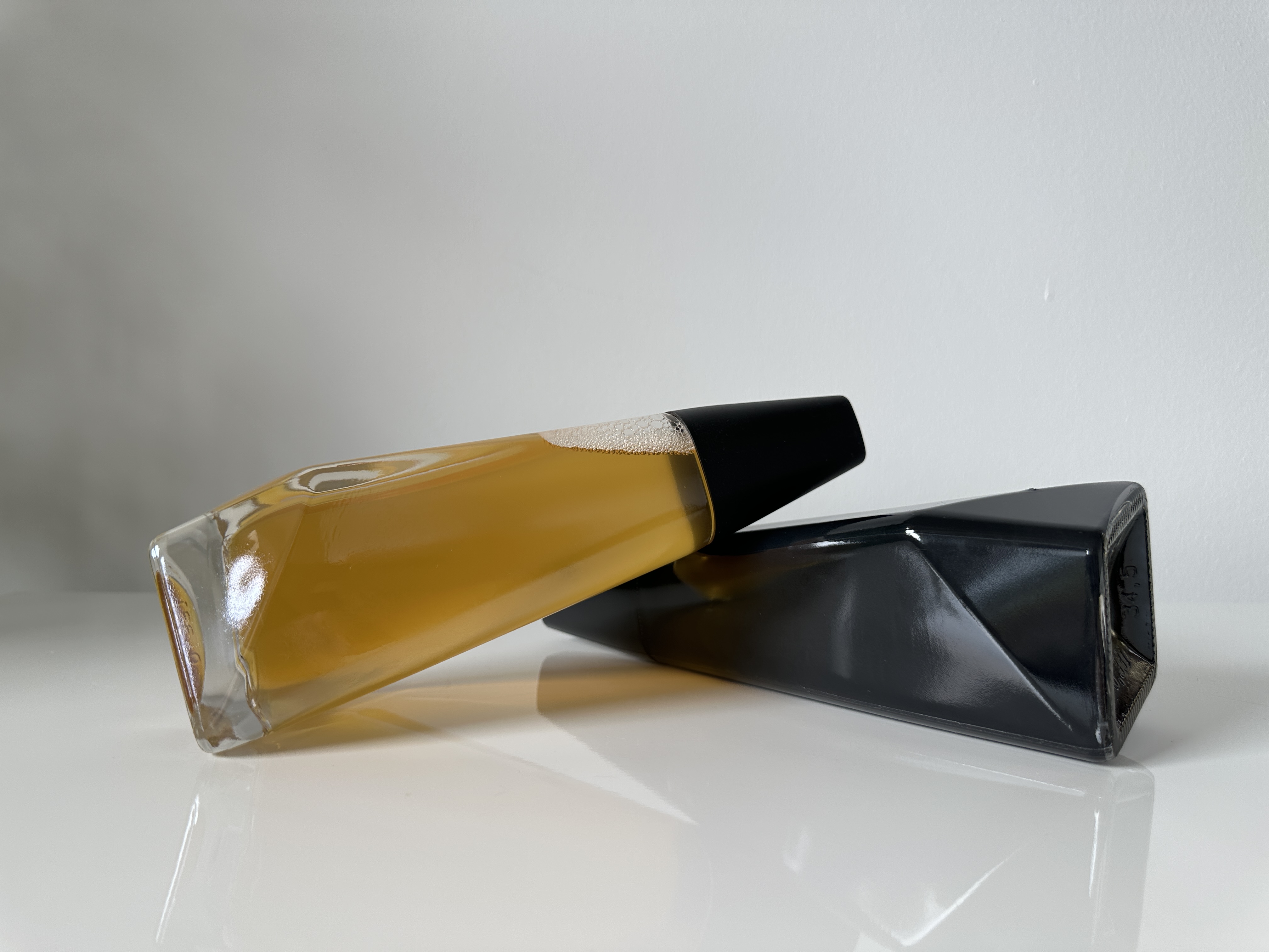 clear and black bottles on side