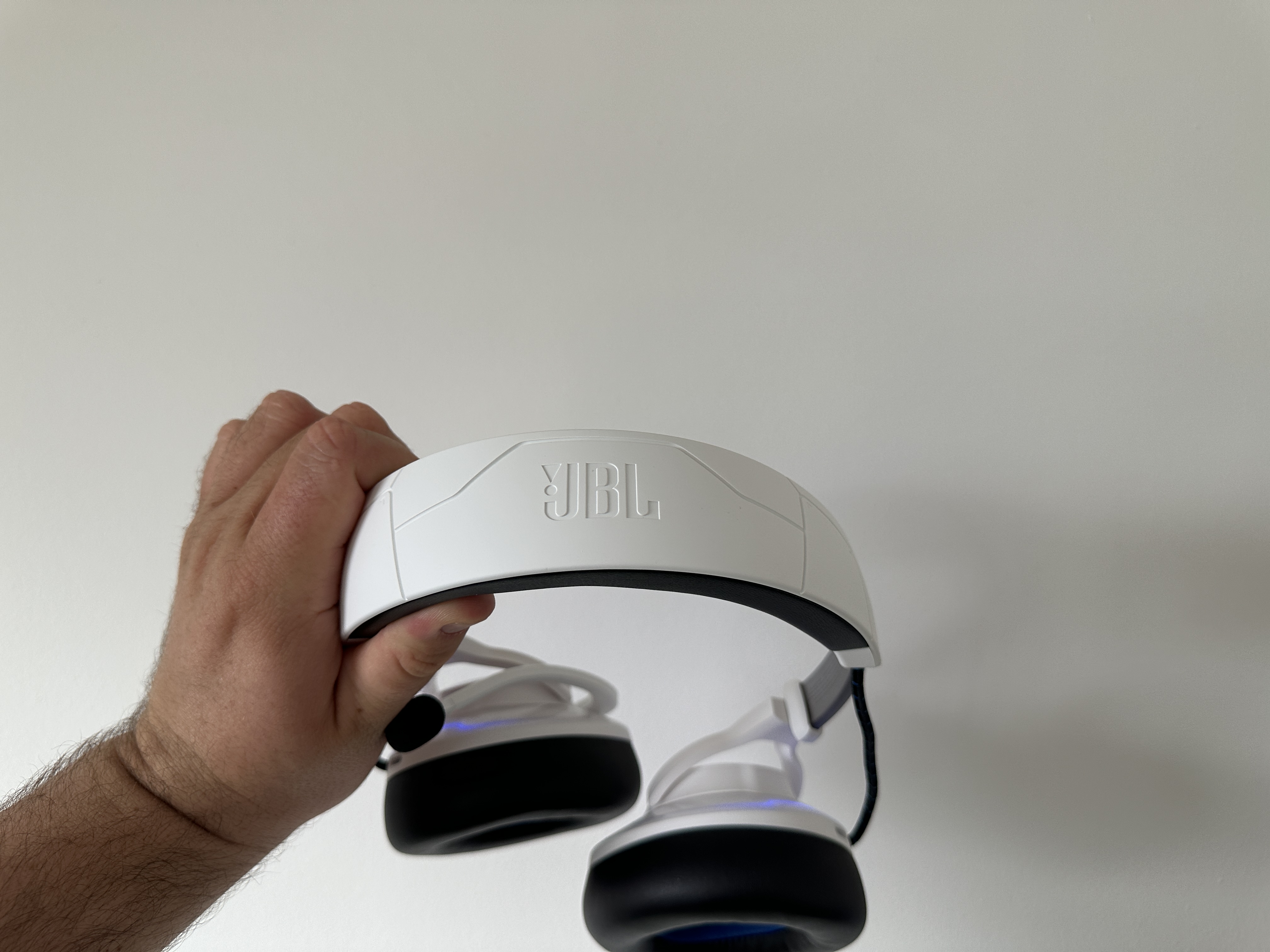 hand holding headset top view